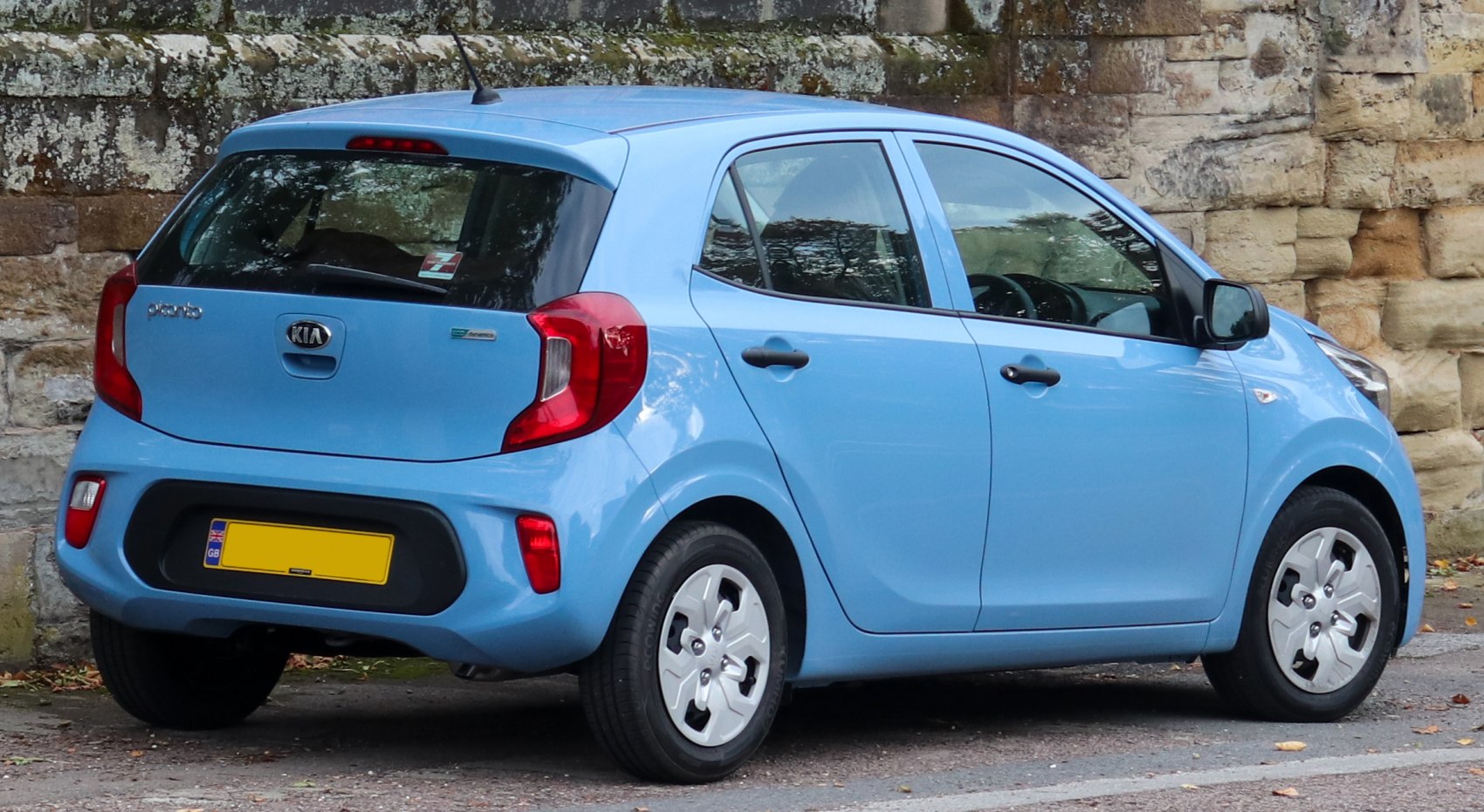 Rear and side view of a compact hatchback with distinctive taillights