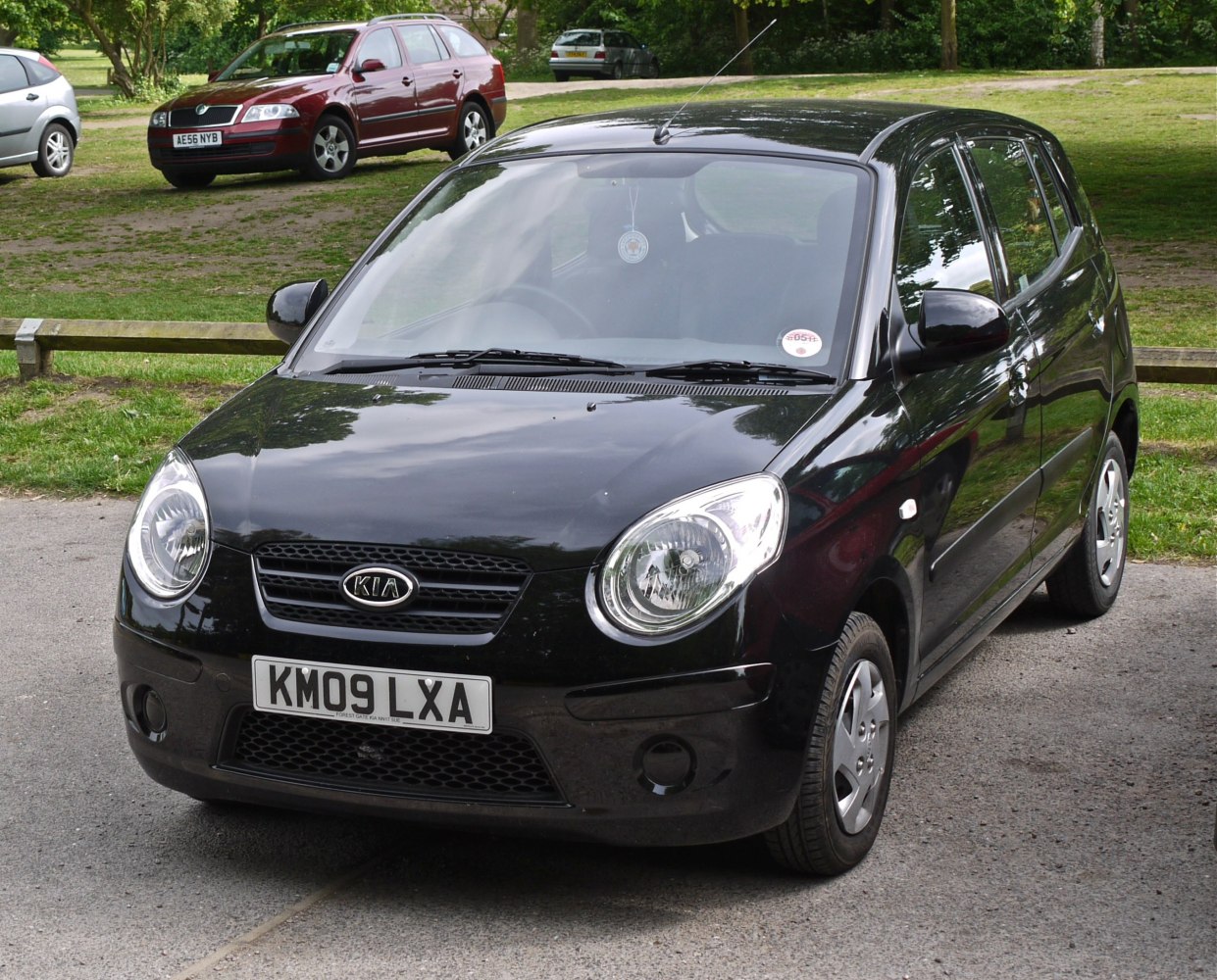 Front view with oval headlights and compact hatchback design