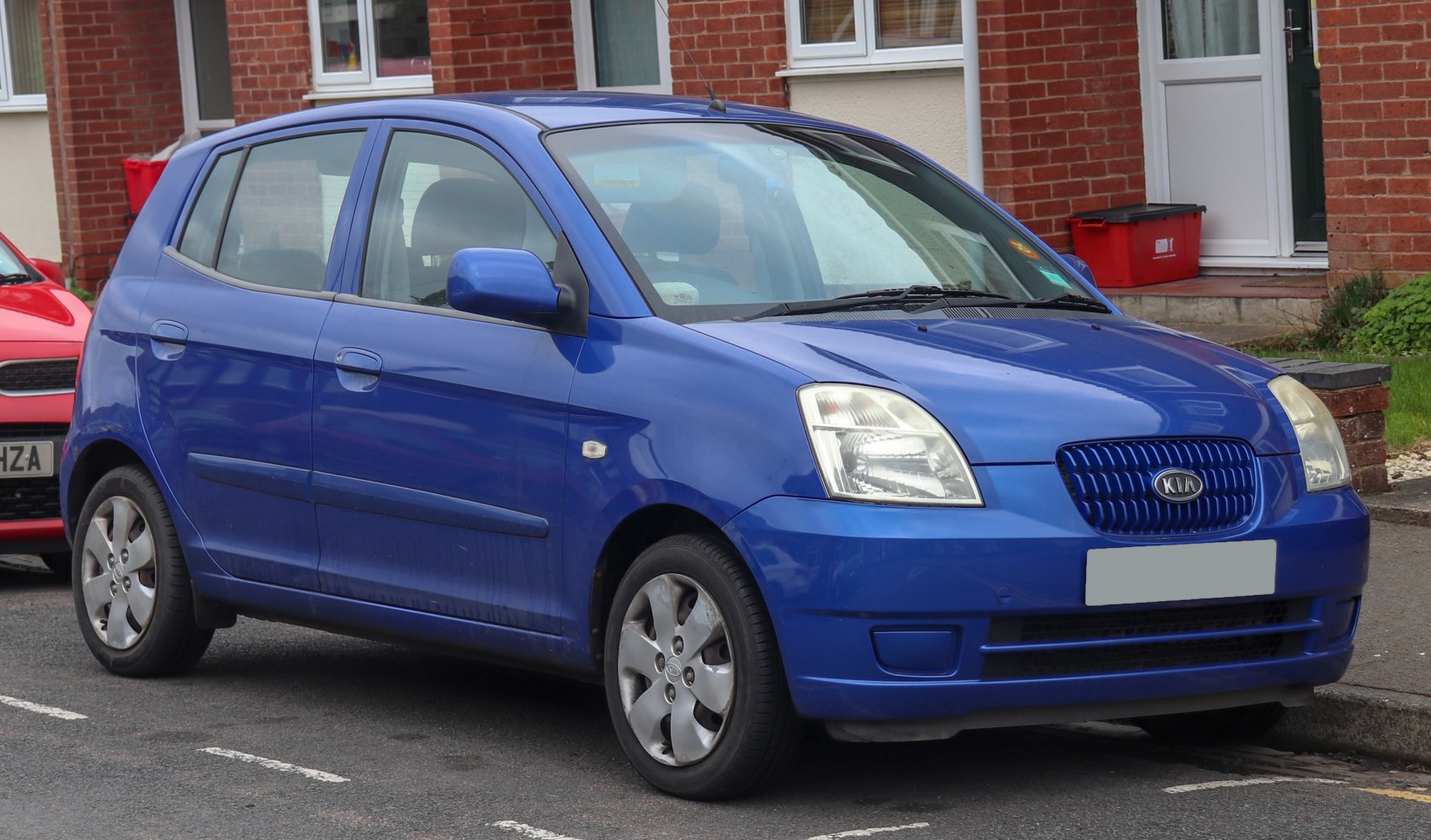 Compact hatchback with rectangular headlights and distinctive grille