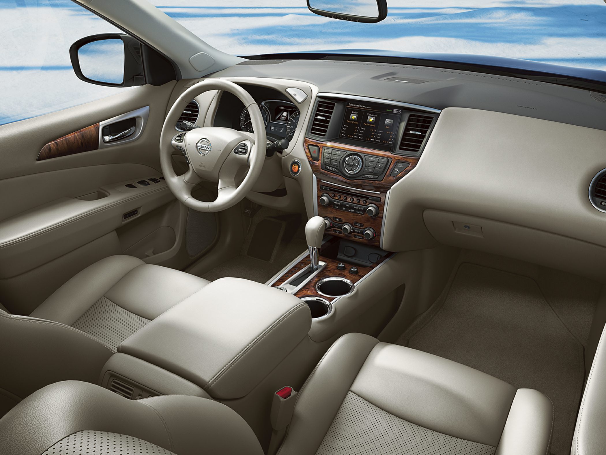 Beige leather interior with wood trim and advanced dashboard.