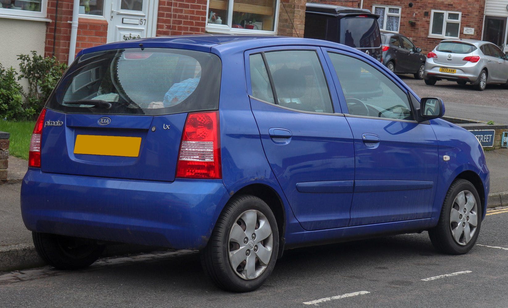 Rear side view of compact hatchback with distinct taillights and five-door layout