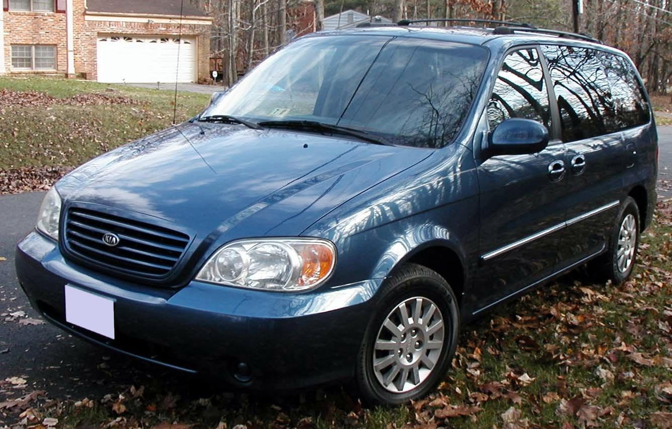 Front view of minivan with alloy wheels and sliding door