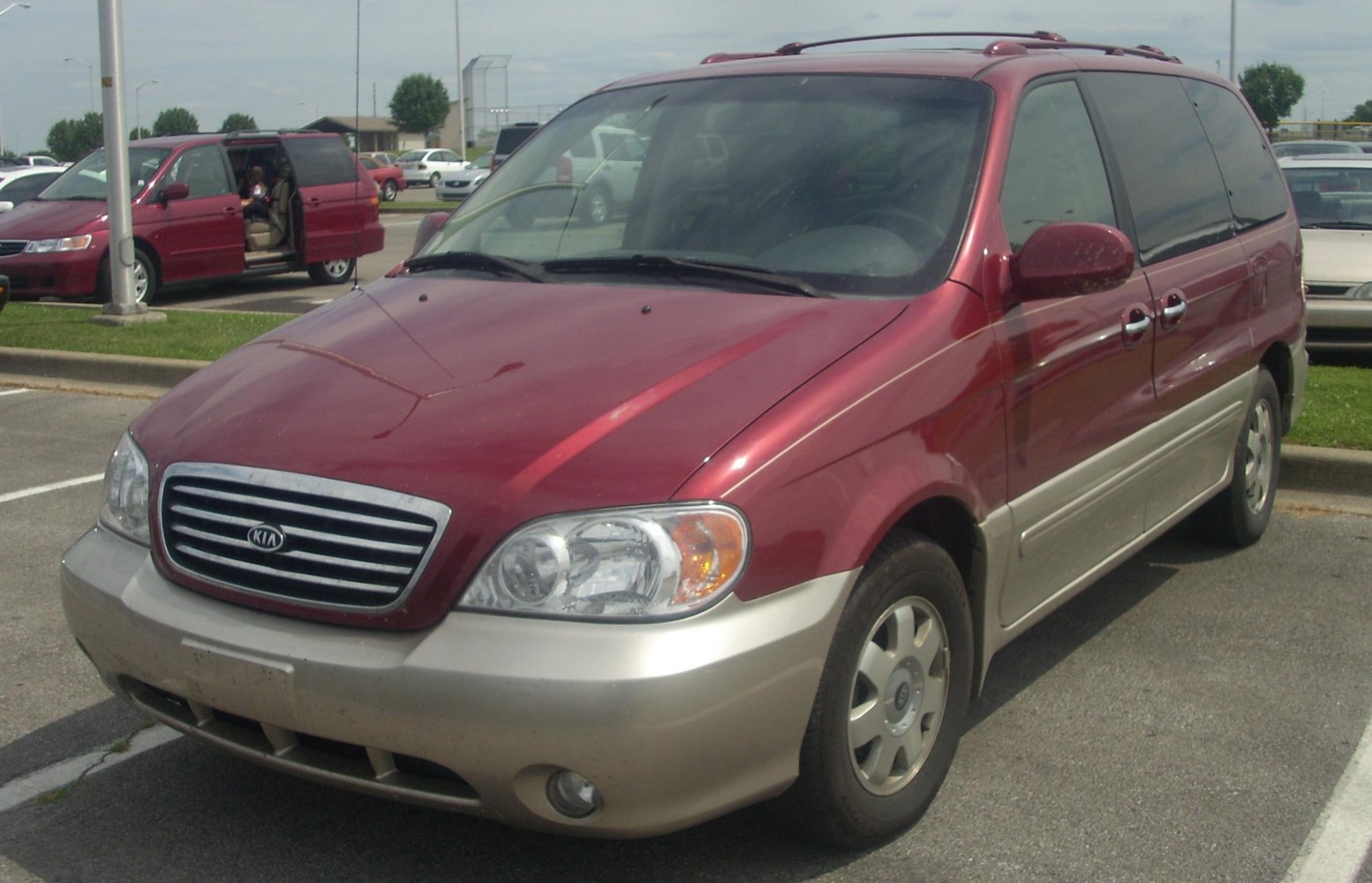 Front view of minivan with two-tone paint and distinct grille.