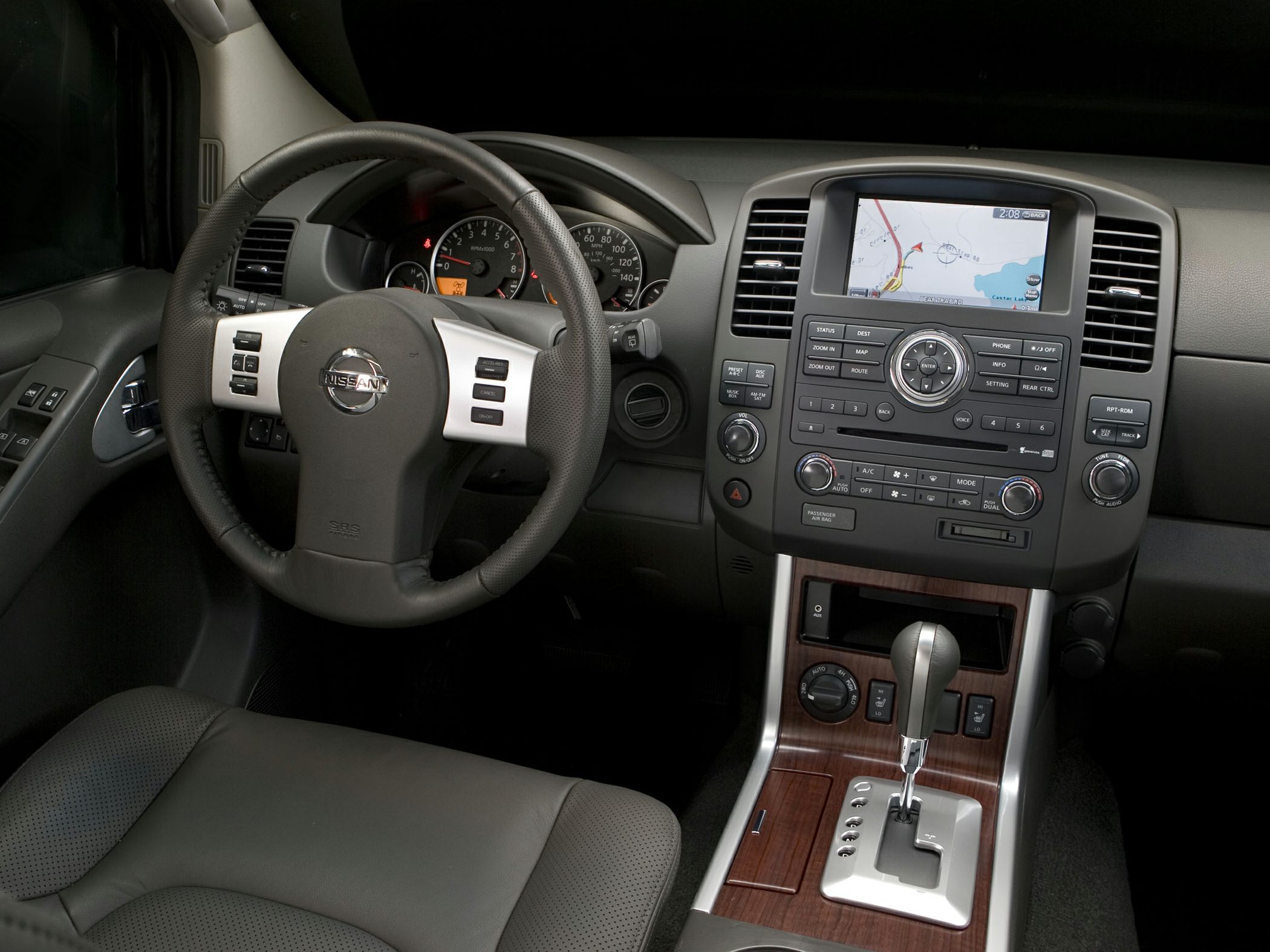 Modern SUV interior with navigation system and steering wheel controls