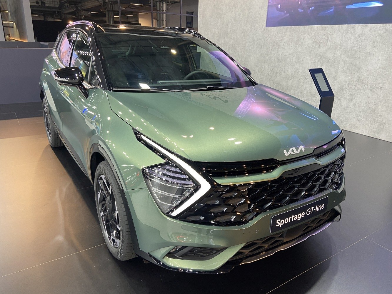 Front view with distinctive LED headlights and modern grille