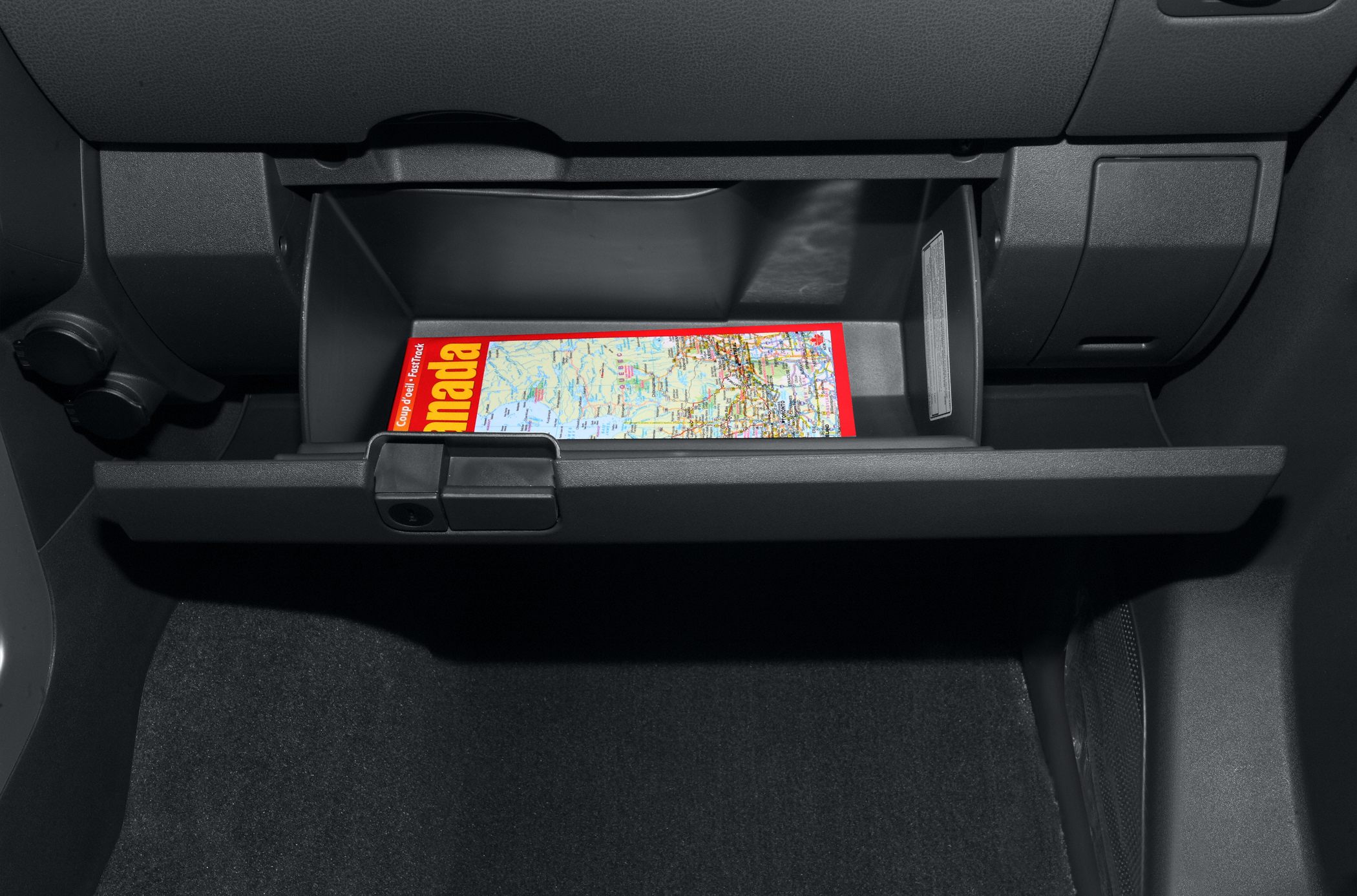 Open glove compartment with a map inside