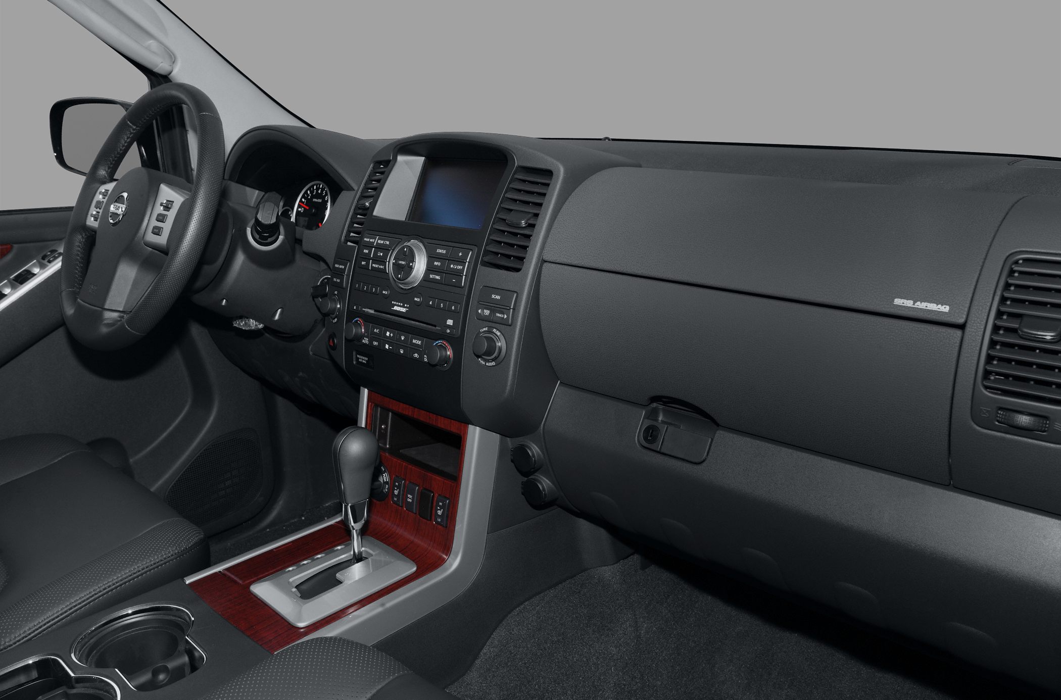 Dashboard and center console with wood trim and automatic gear lever