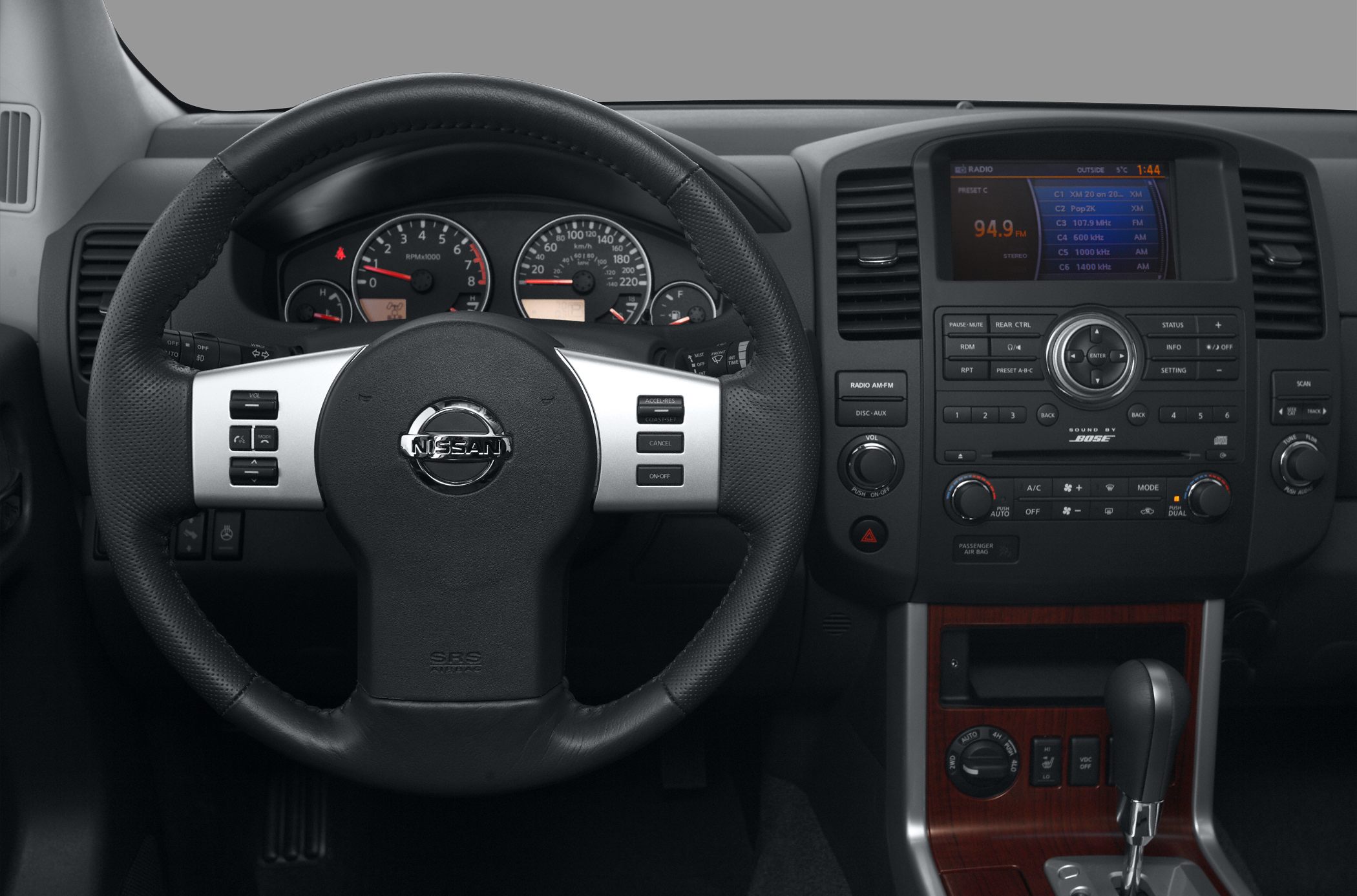 Steering wheel and dashboard with center console controls