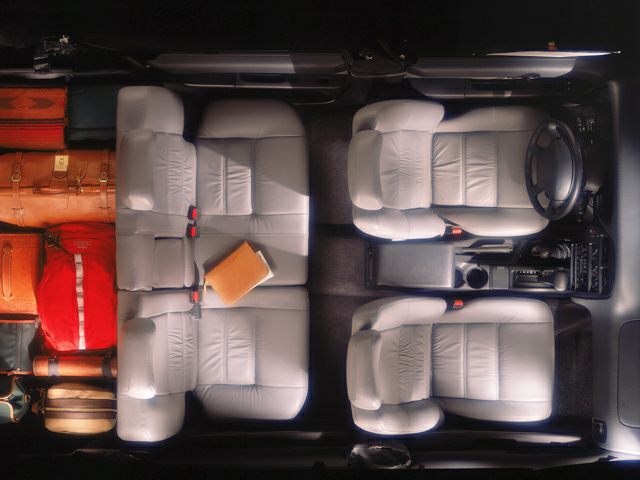 Top-down view of SUV seating and rear storage with luggage
