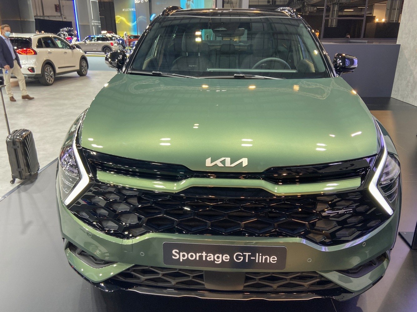 Front grille with honeycomb pattern and LED daytime running lights.