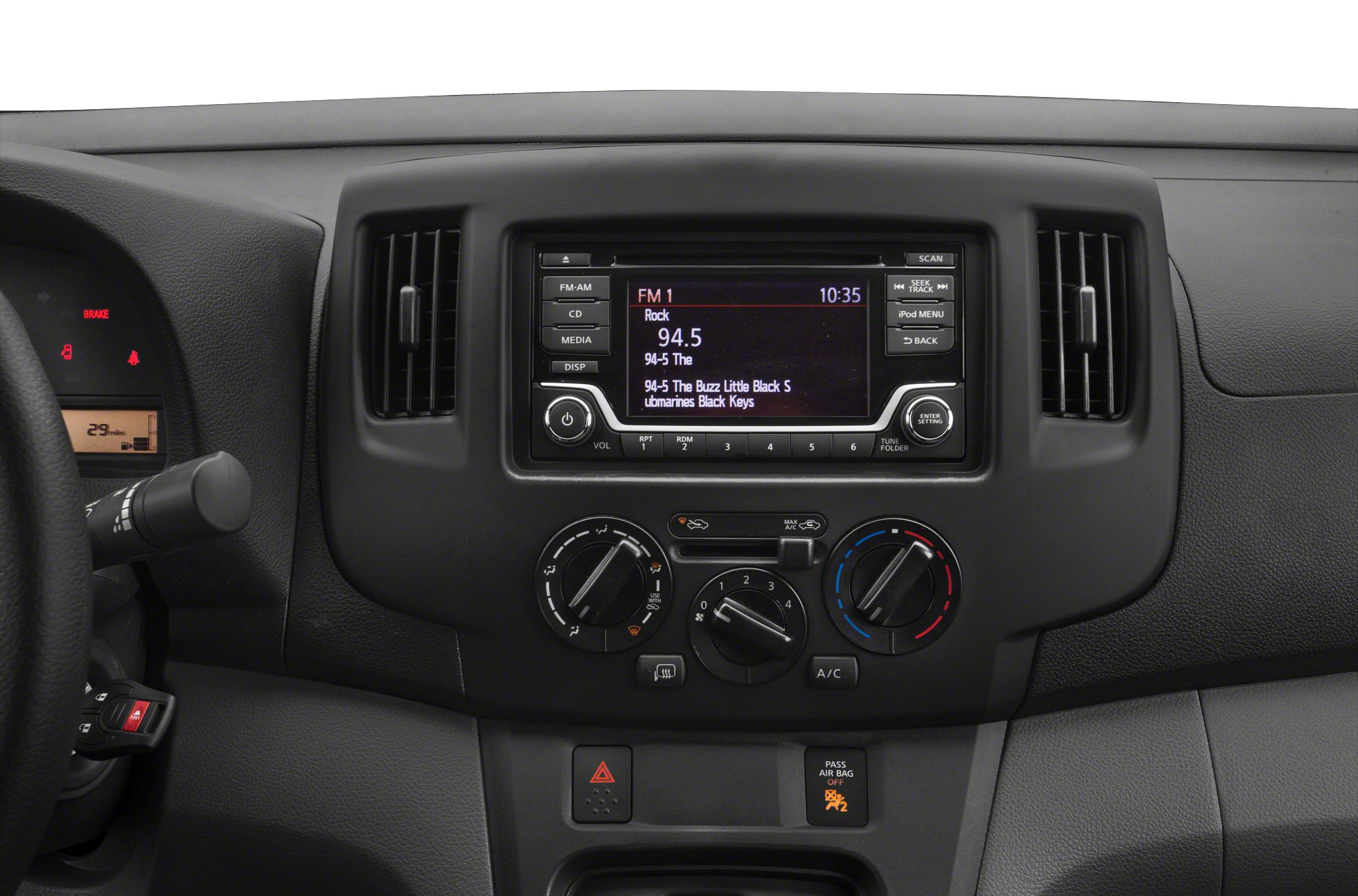 Car dashboard with central audio system and manual climate controls
