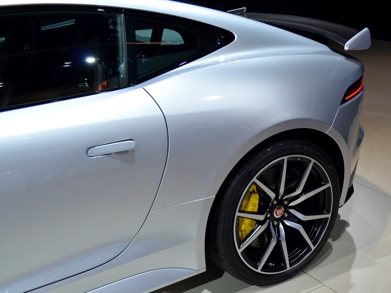 Rear side profile with alloy wheel and yellow brake caliper