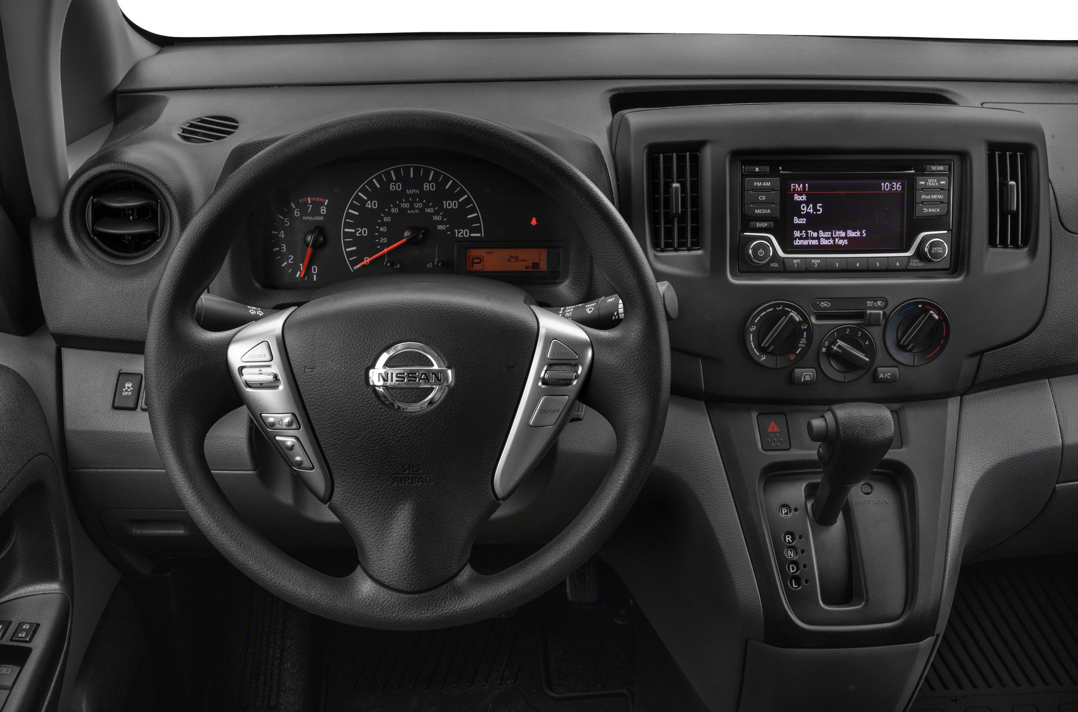 Steering wheel with controls and dashboard including speedometer and infotainment system