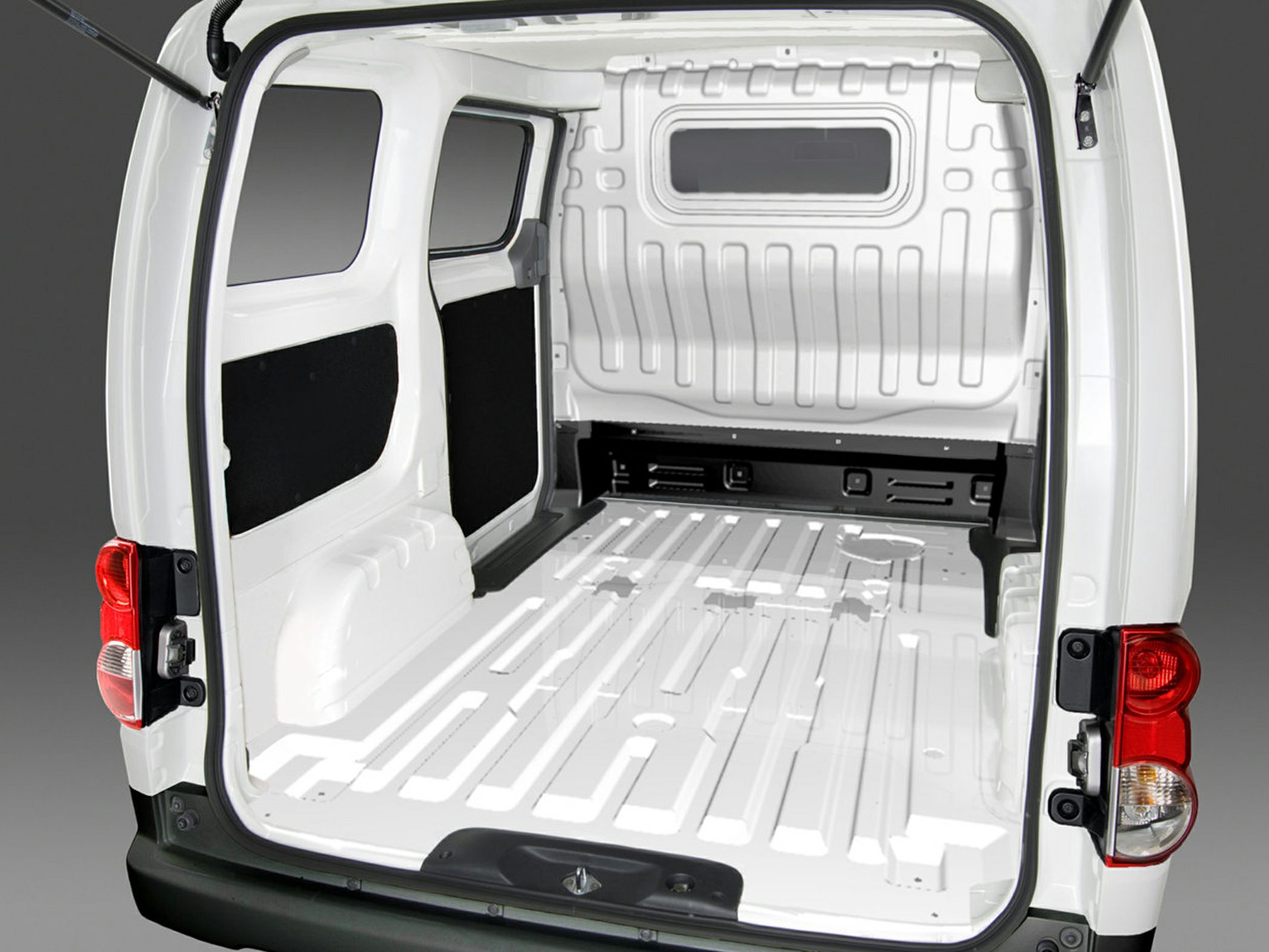 Open rear cargo space and loading area of a van interior