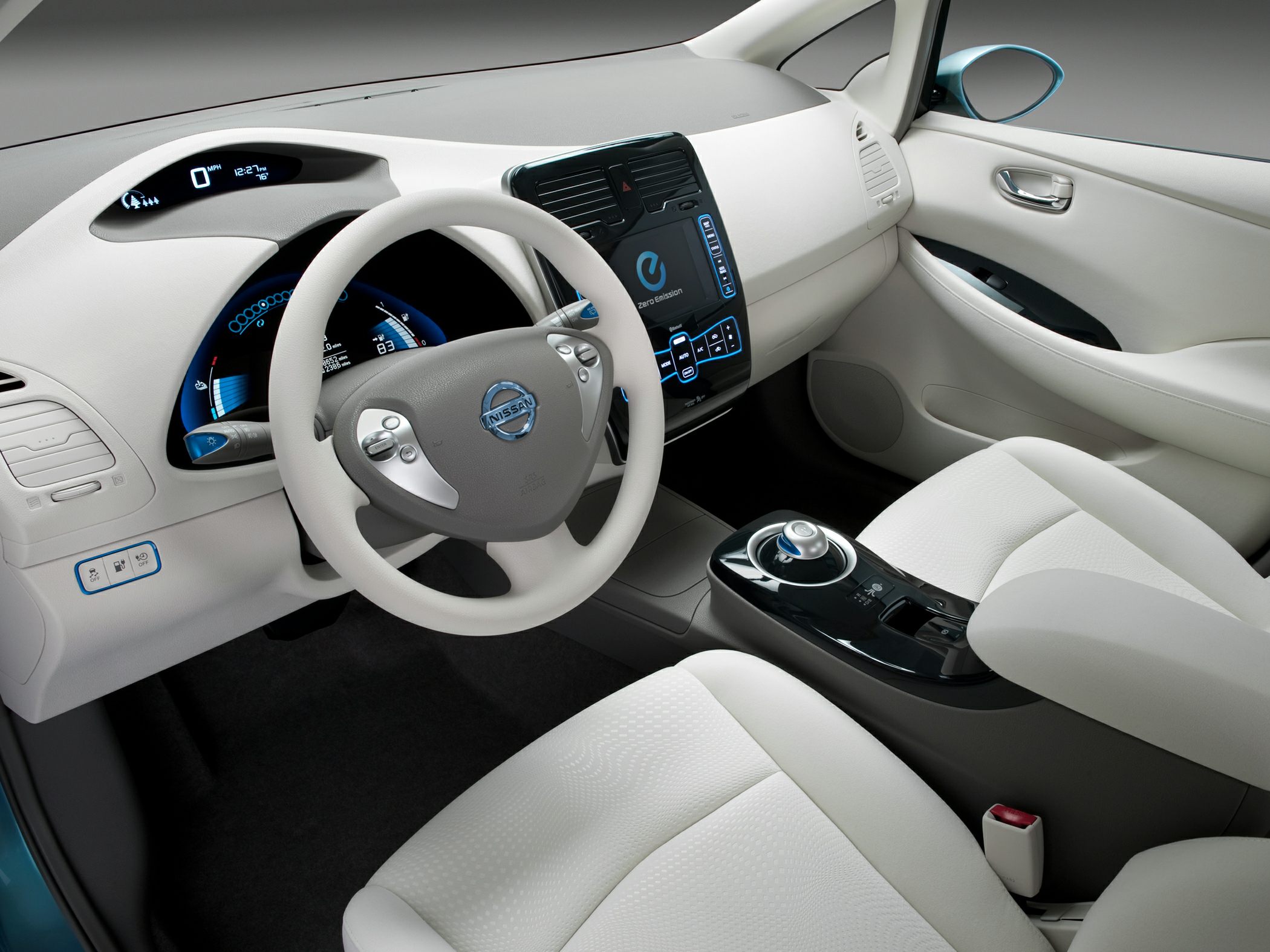 Interior dashboard, digital displays, steering wheel, and gear selector