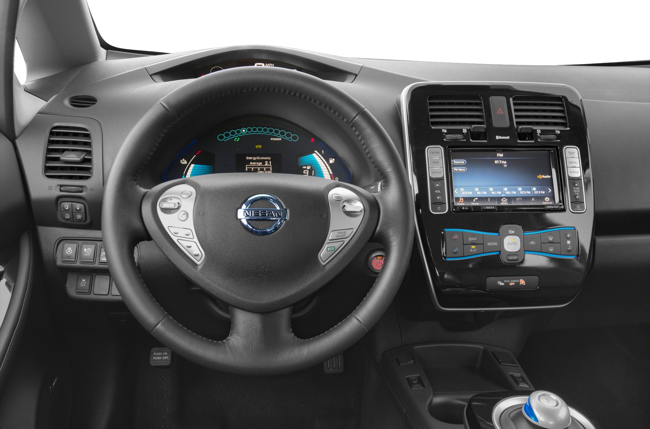 Dashboard, steering wheel, center console with infotainment and climate control.