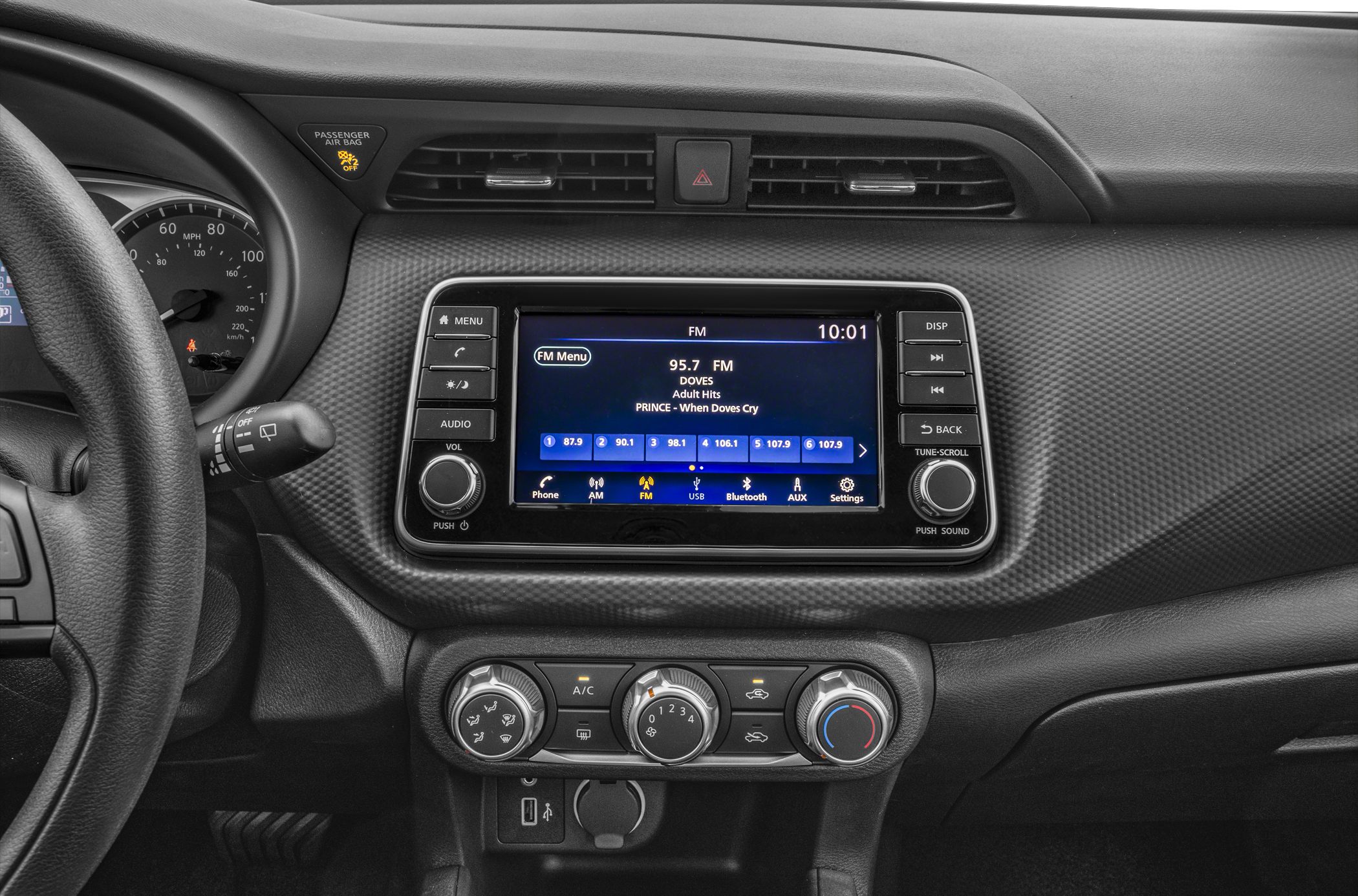 Dashboard with infotainment touchscreen and climate control dials