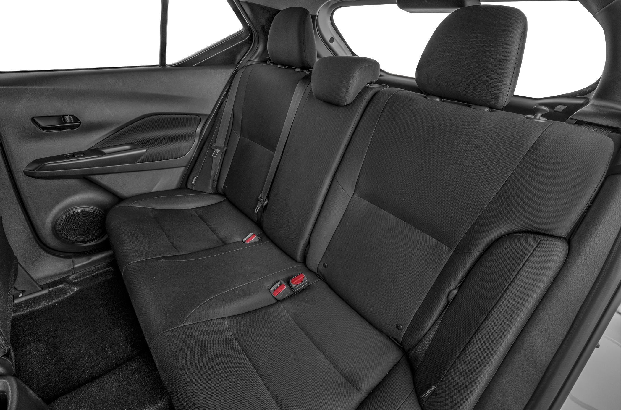 Rear seat with black upholstery and modern door panel.