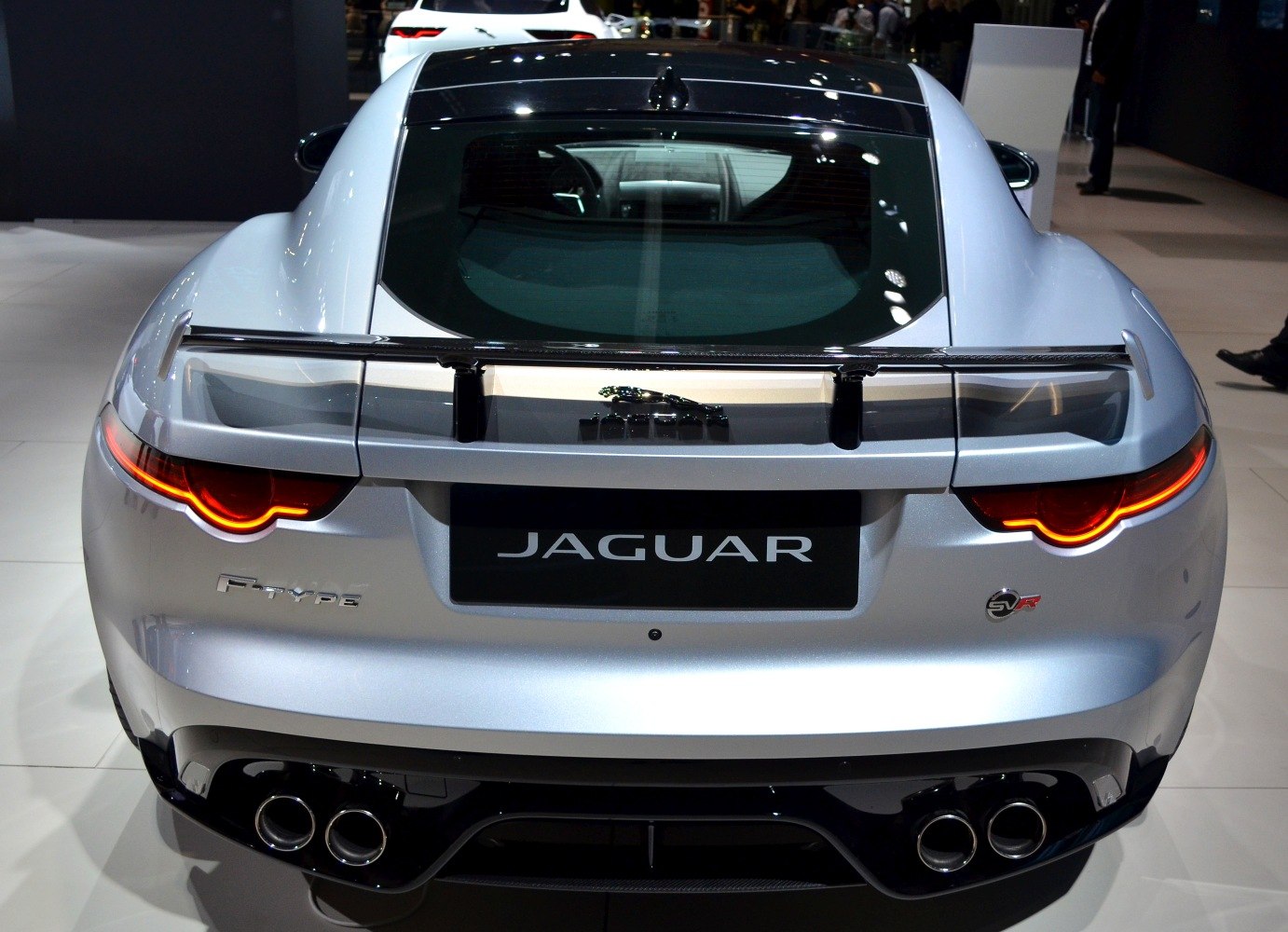 Rear view of a luxury coupe with quad exhaust and LED taillights