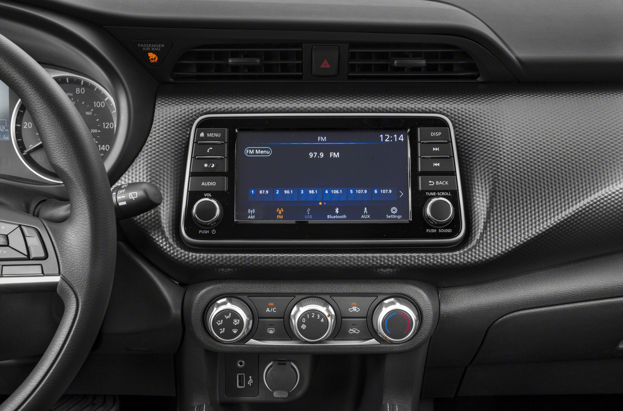 Dashboard with digital infotainment screen and climate control knobs