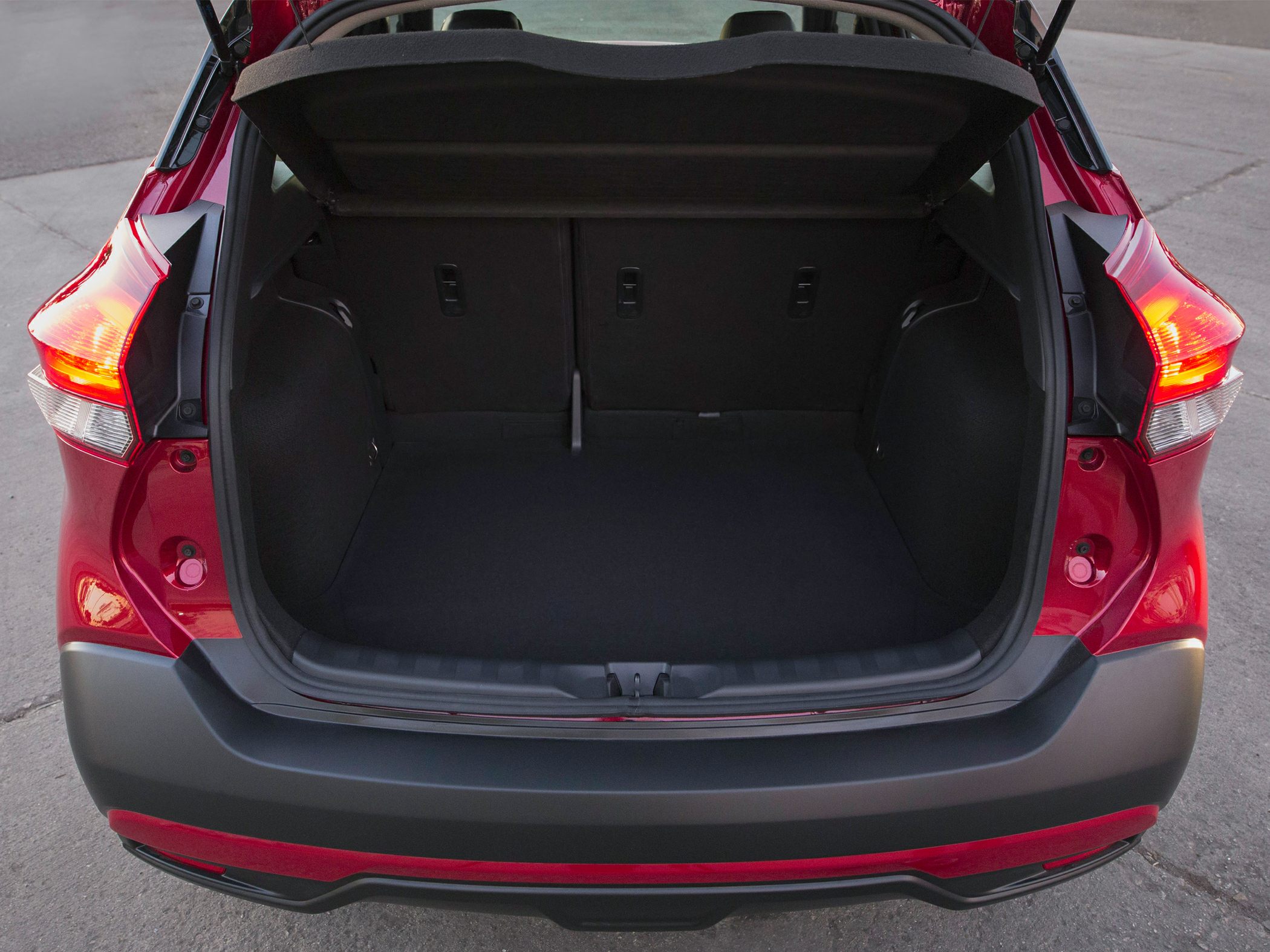 Open rear trunk cargo space with taillights