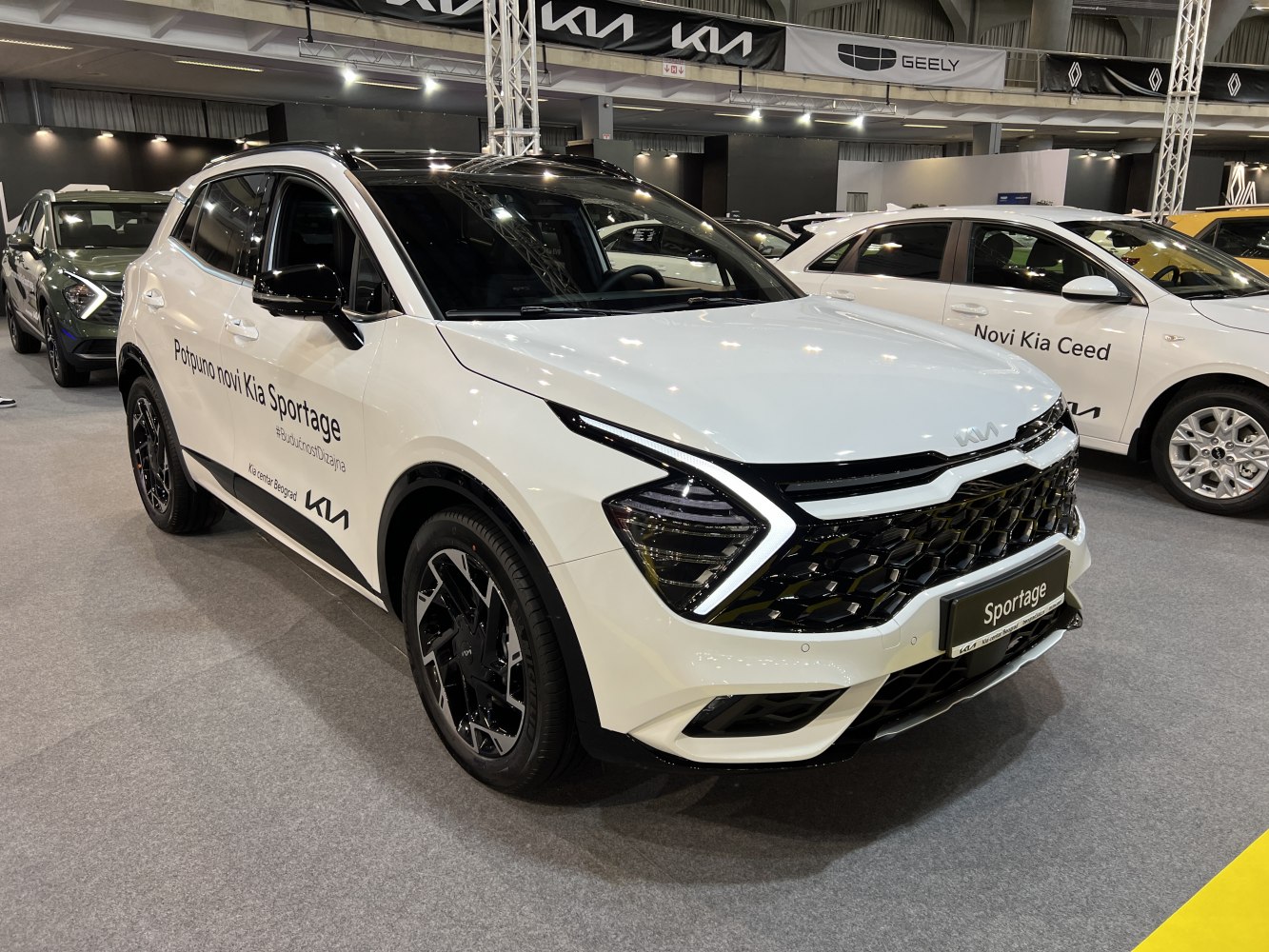 White SUV with distinctive angular LED headlights and honeycomb black grille
