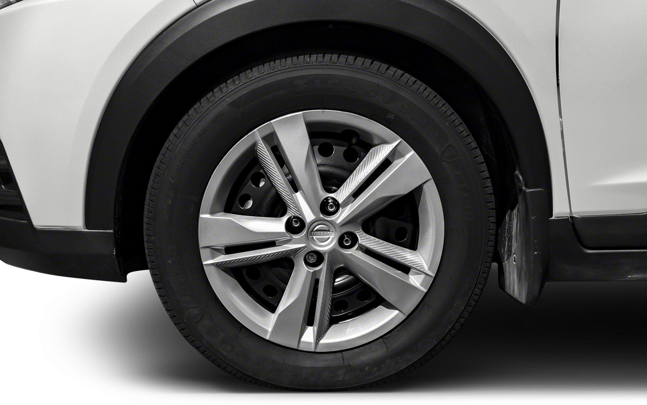 Close-up of alloy wheel and tire with unique rim design and tire branding.