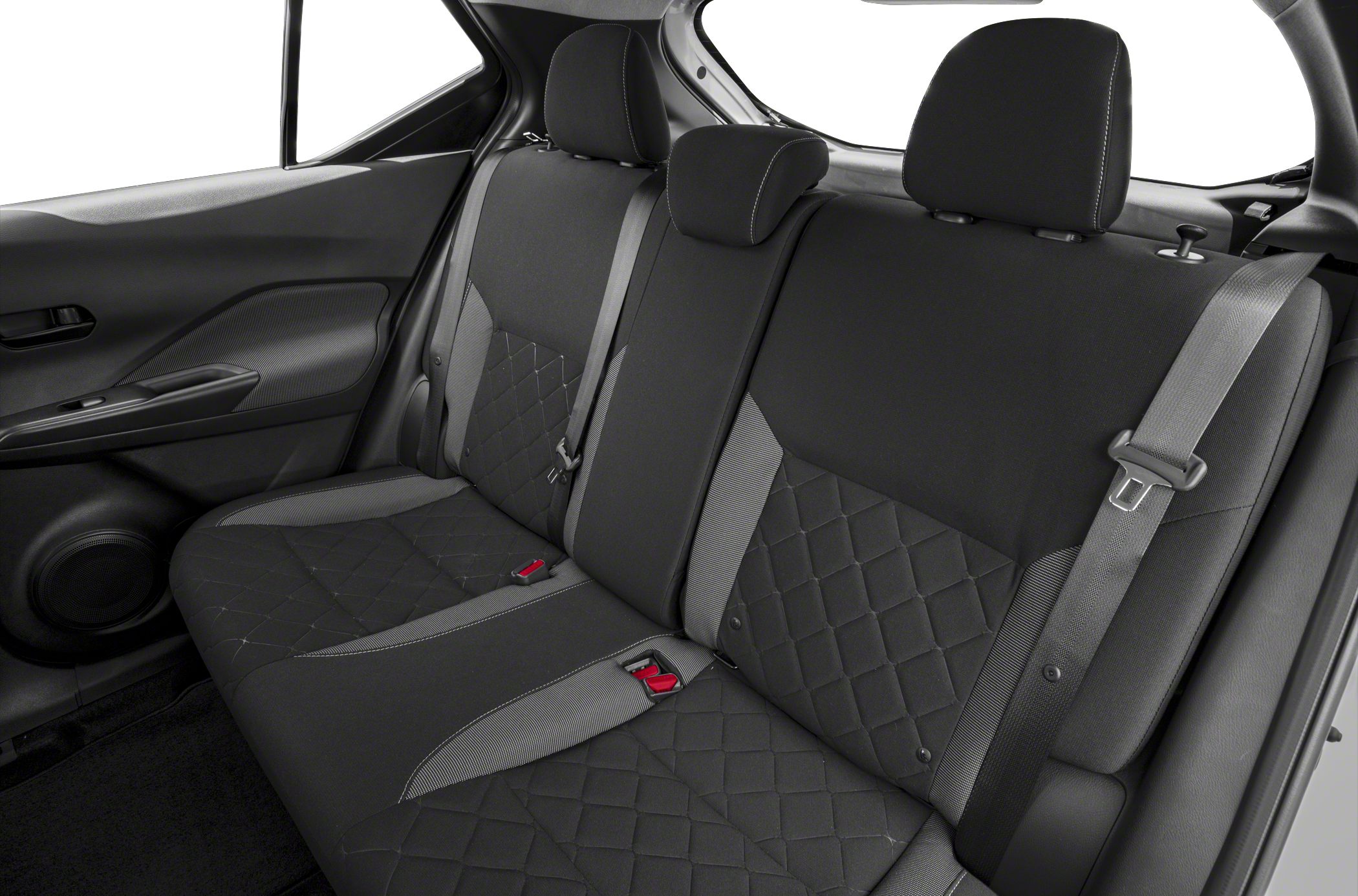 Quilted rear seat upholstery with integrated headrests and seat belts