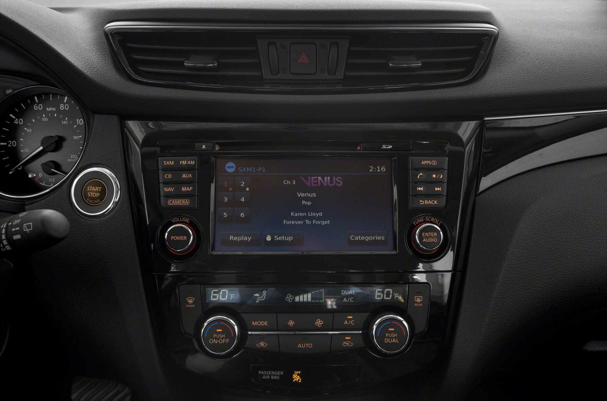Infotainment touchscreen and dual-zone climate controls in car dashboard