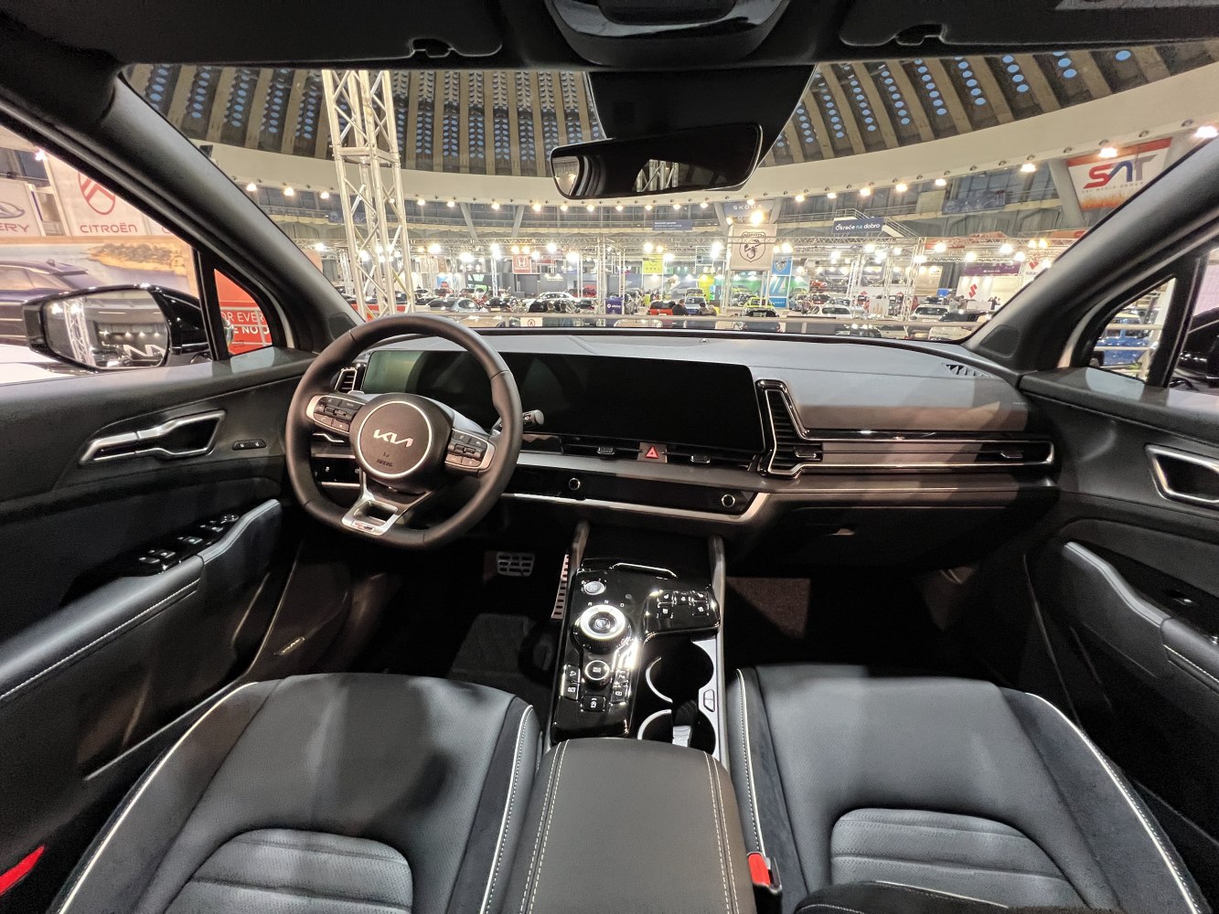 Modern digital dashboard and multifunction steering wheel in car cockpit
