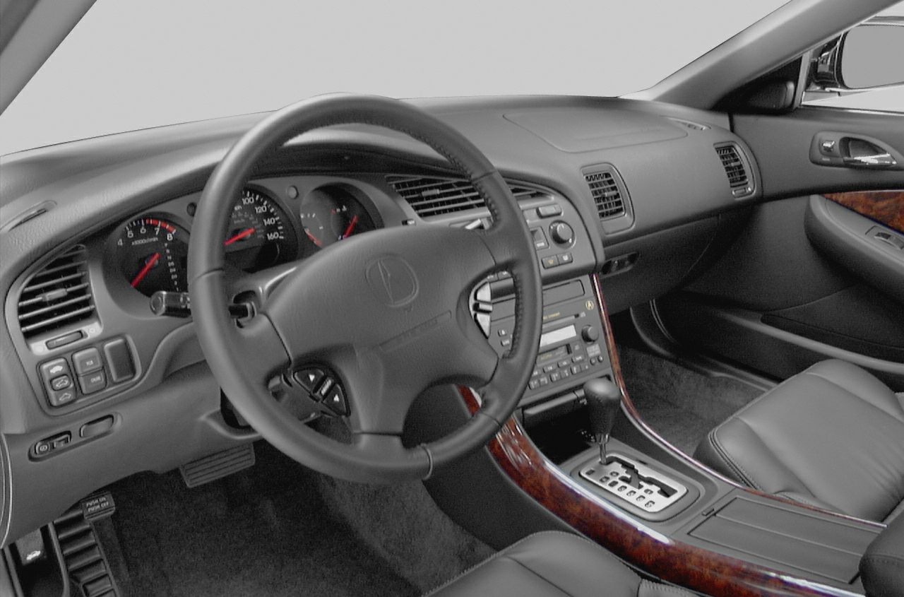 Leather steering wheel, wood grain center console, and dashboard layout