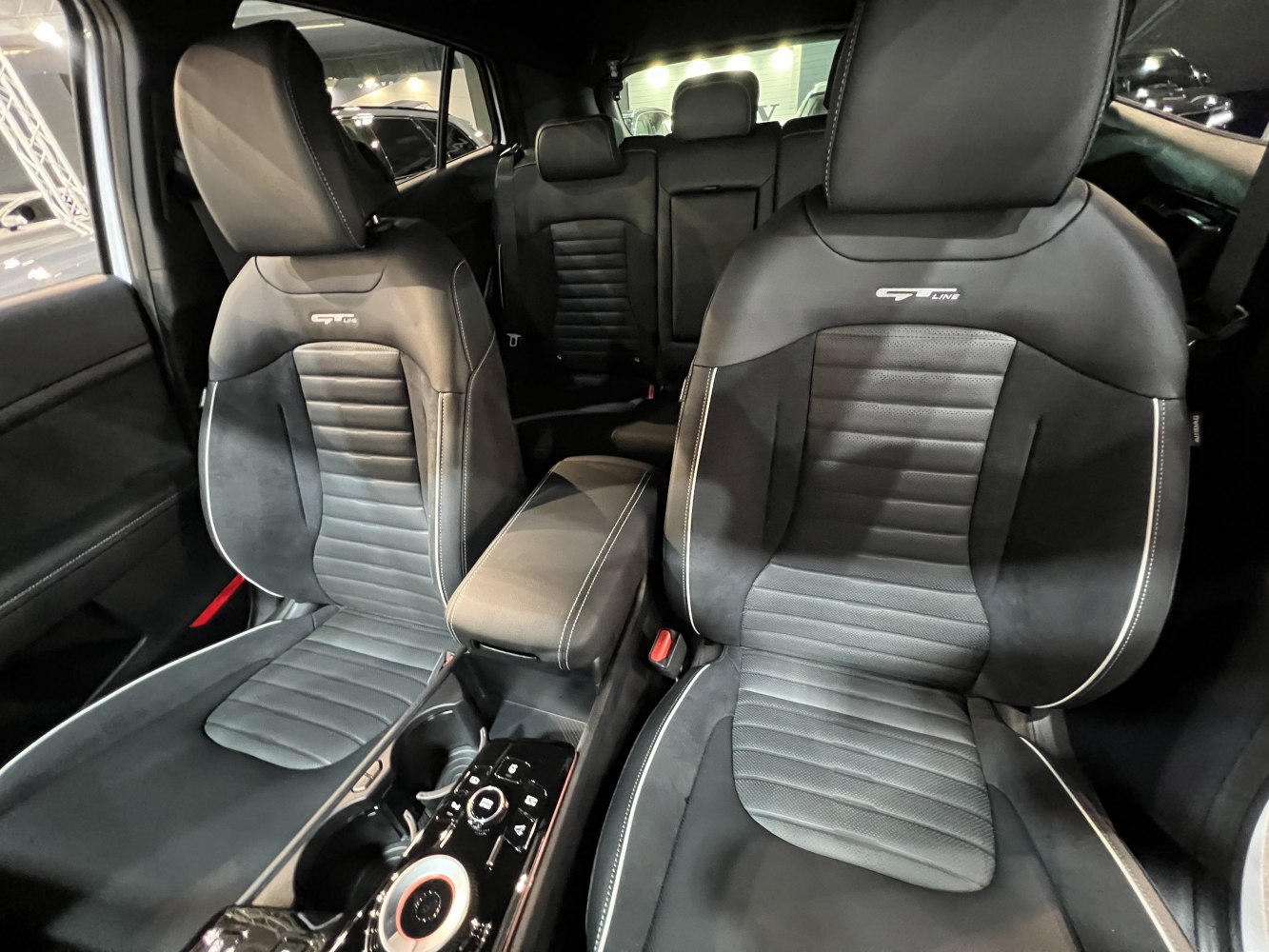 Black leather GT Line seats and sleek center console with control dial.