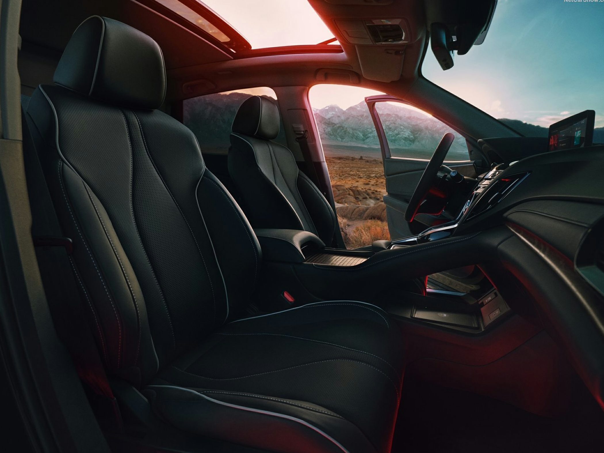 Luxury leather seats and panoramic sunroof with center console.