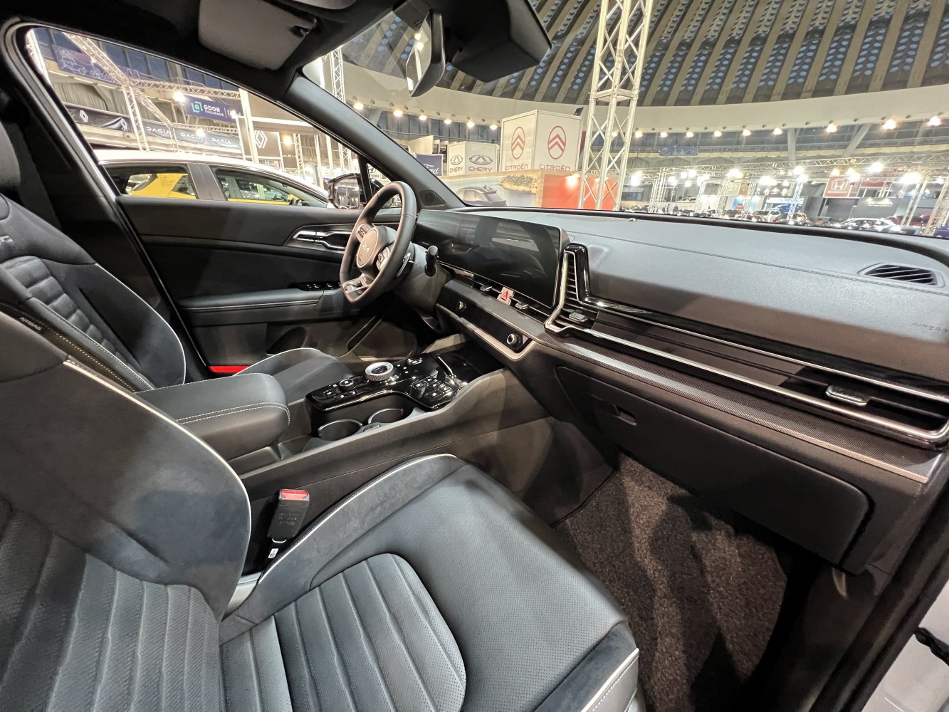 Modern digital dashboard and sleek center console in a car interior