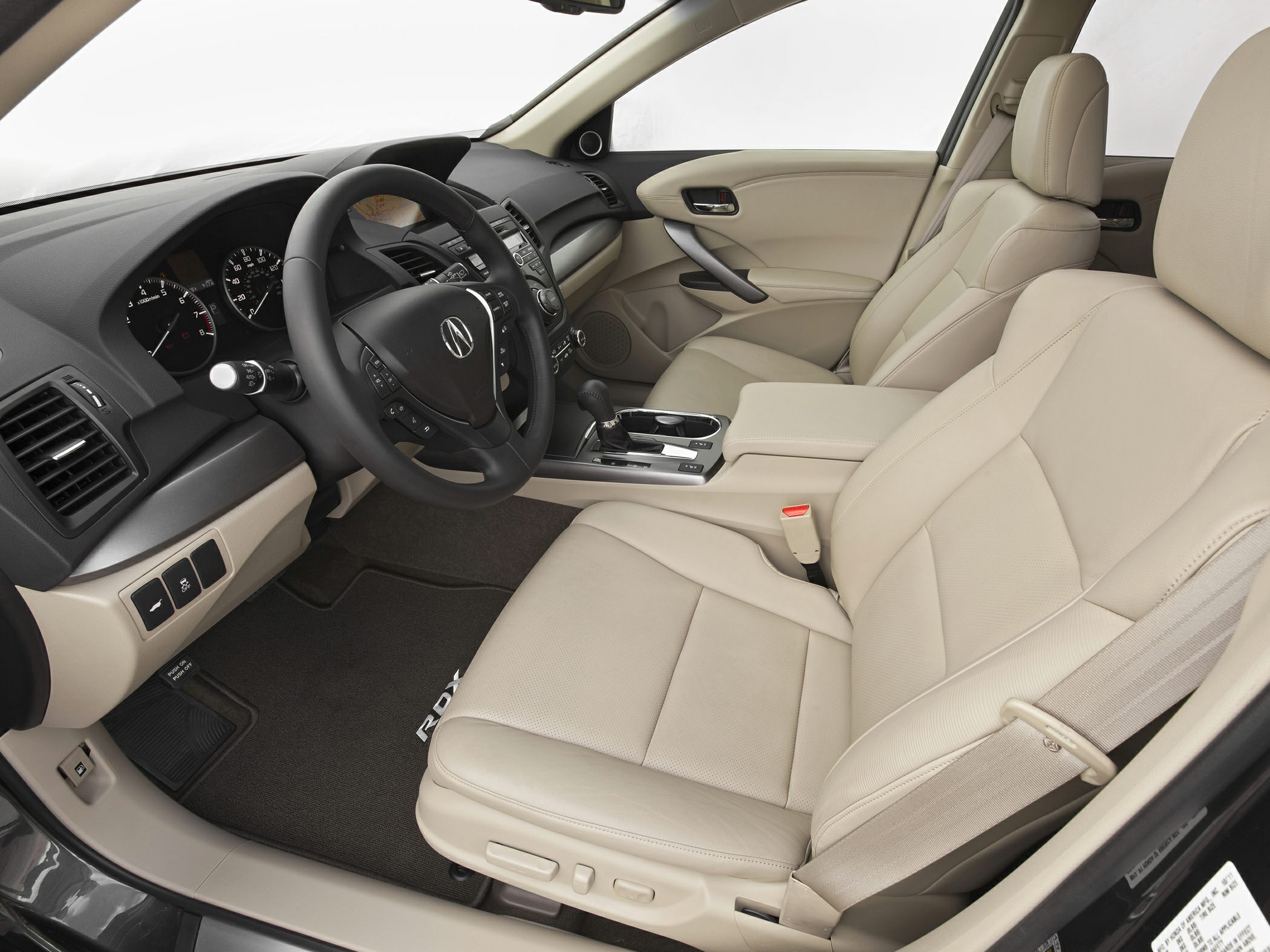 Beige leather front seats and dashboard with steering wheel and center console