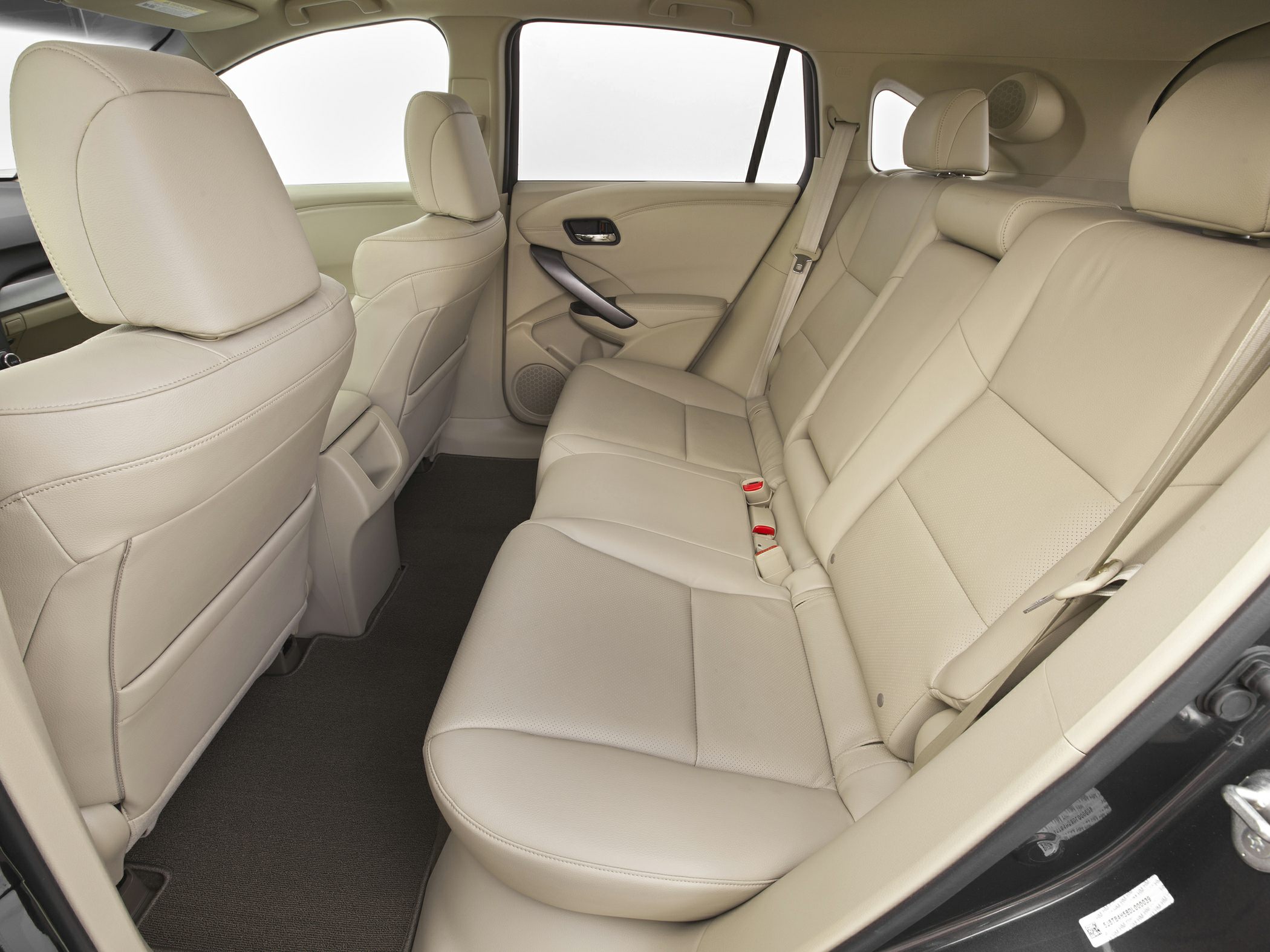 Beige leather rear seats with spacious legroom and modern door panel