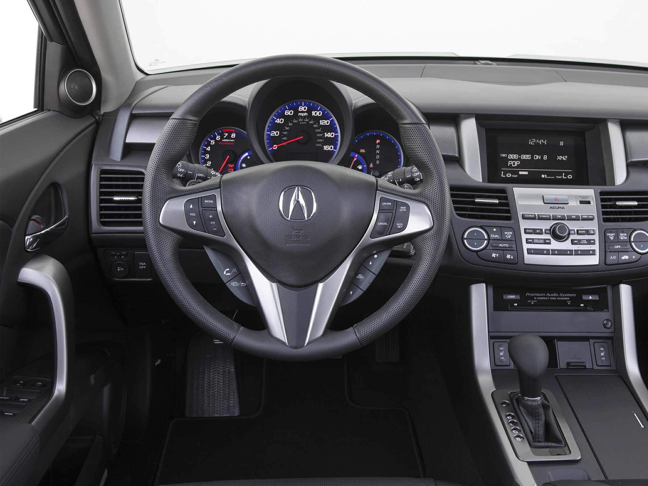 Steering wheel with controls and dashboard with premium audio system