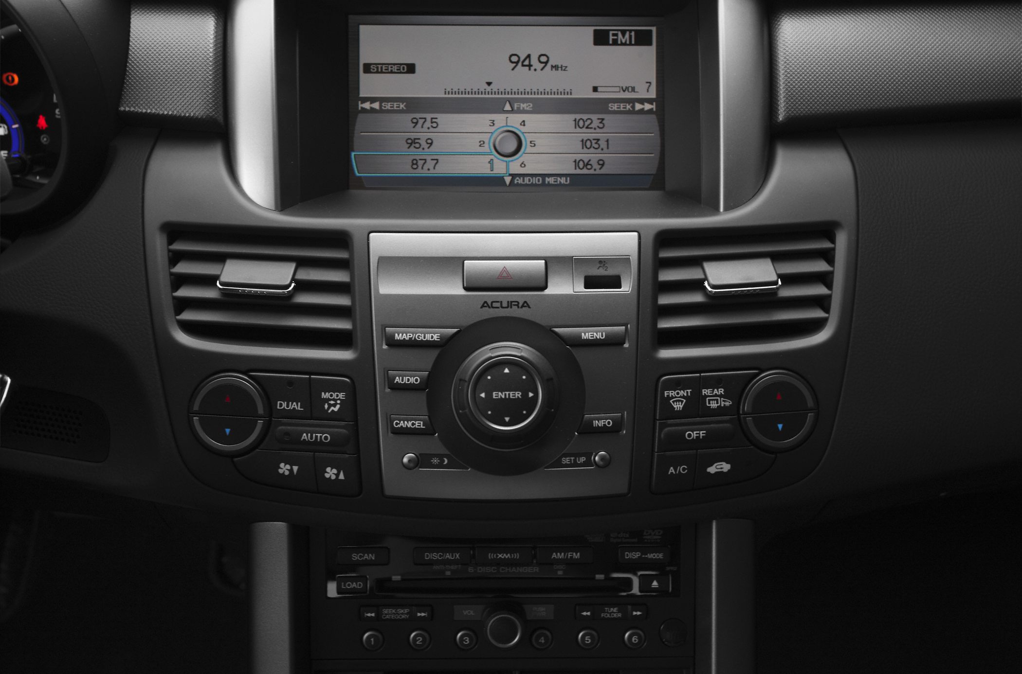 Infotainment screen with FM radio and dual-zone climate control panel
