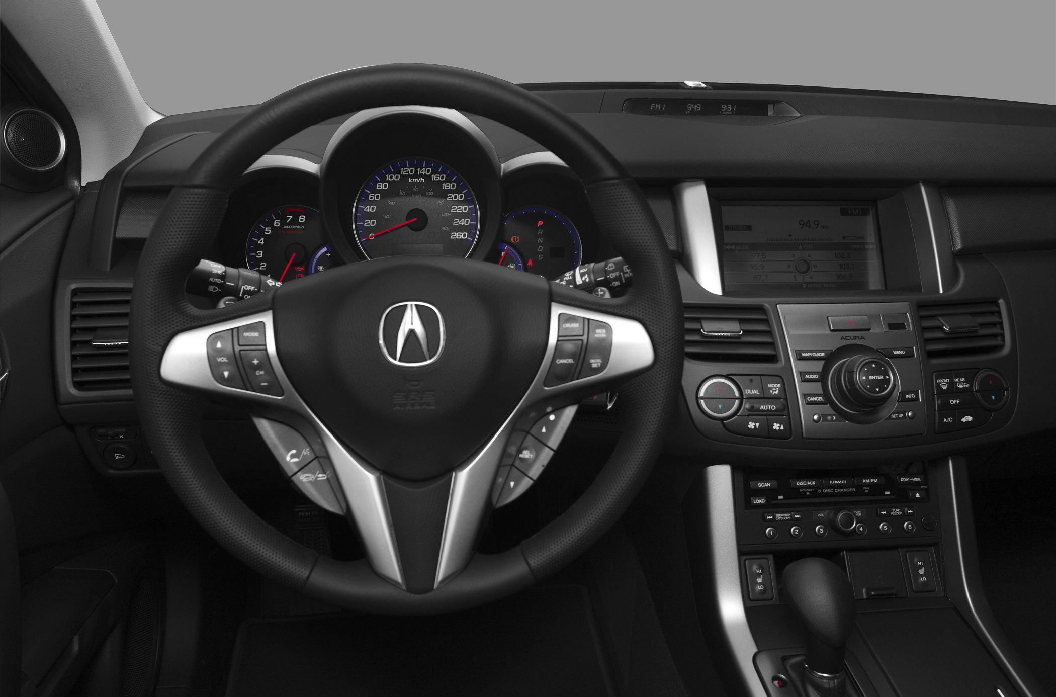 Dashboard with multifunction steering wheel and center console controls