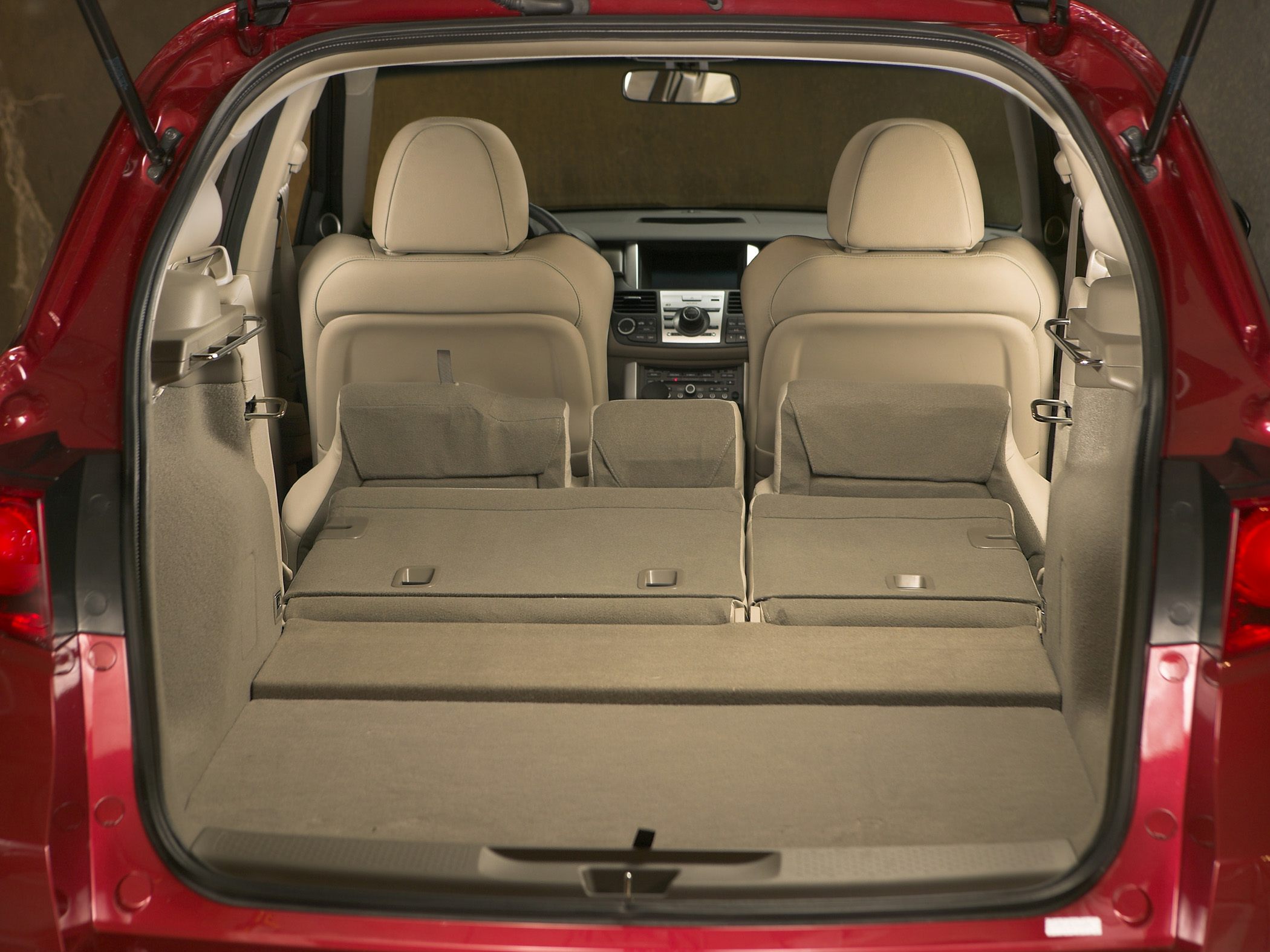 Folded rear seats creating a large cargo area and front seat backs.