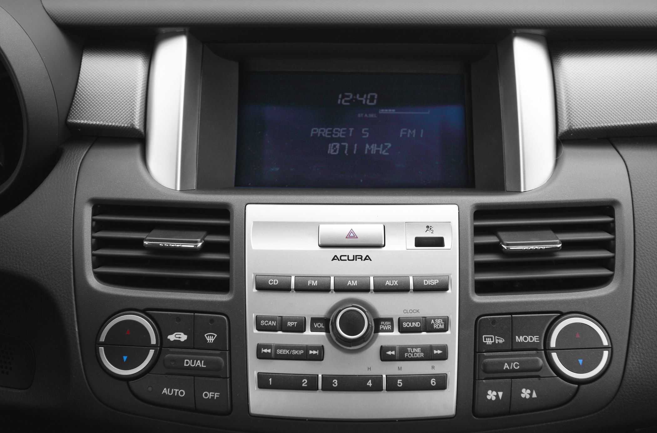 Center console with audio system and climate control buttons.
