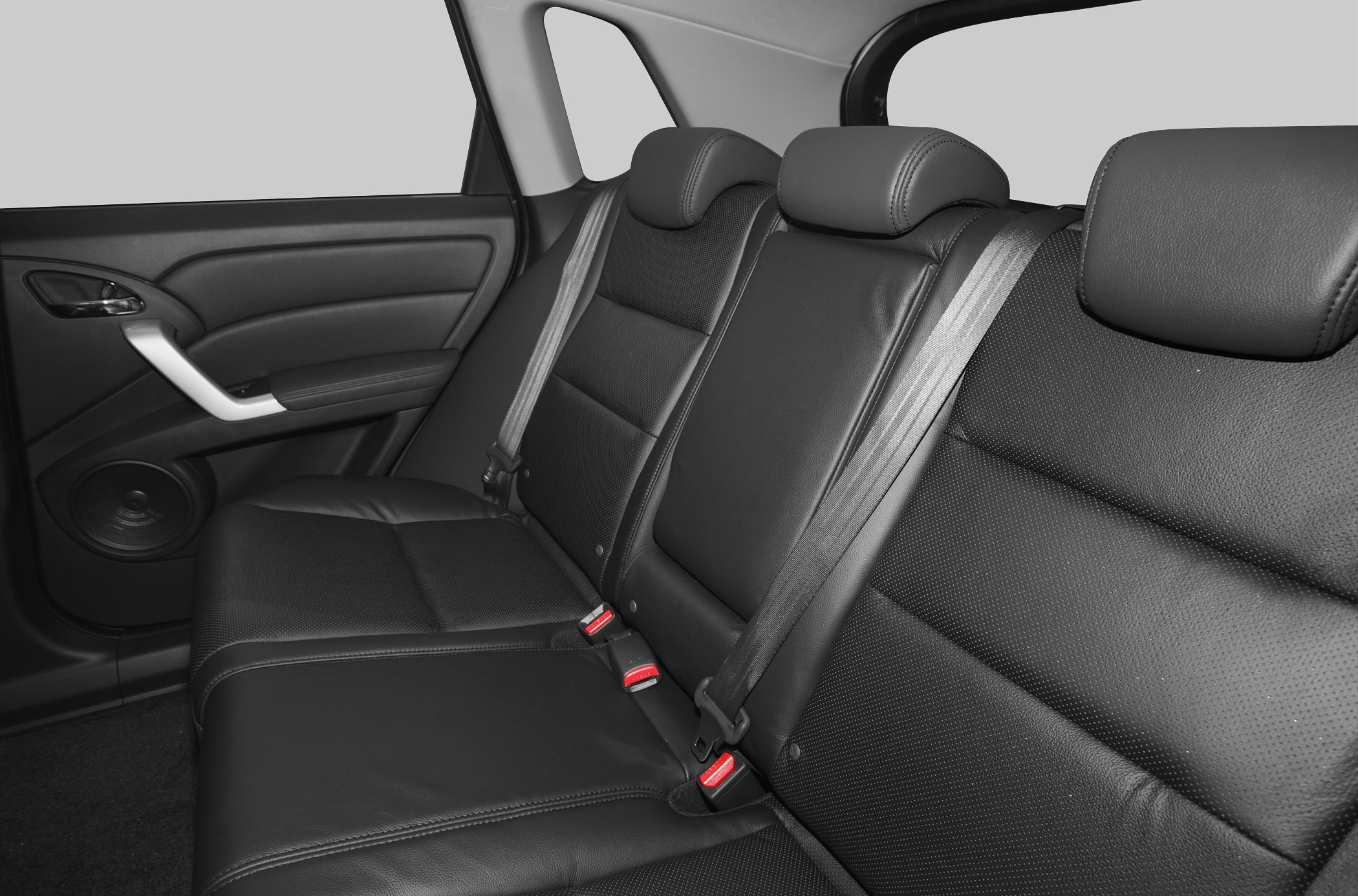Black leather rear seats with seatbelts in car interior