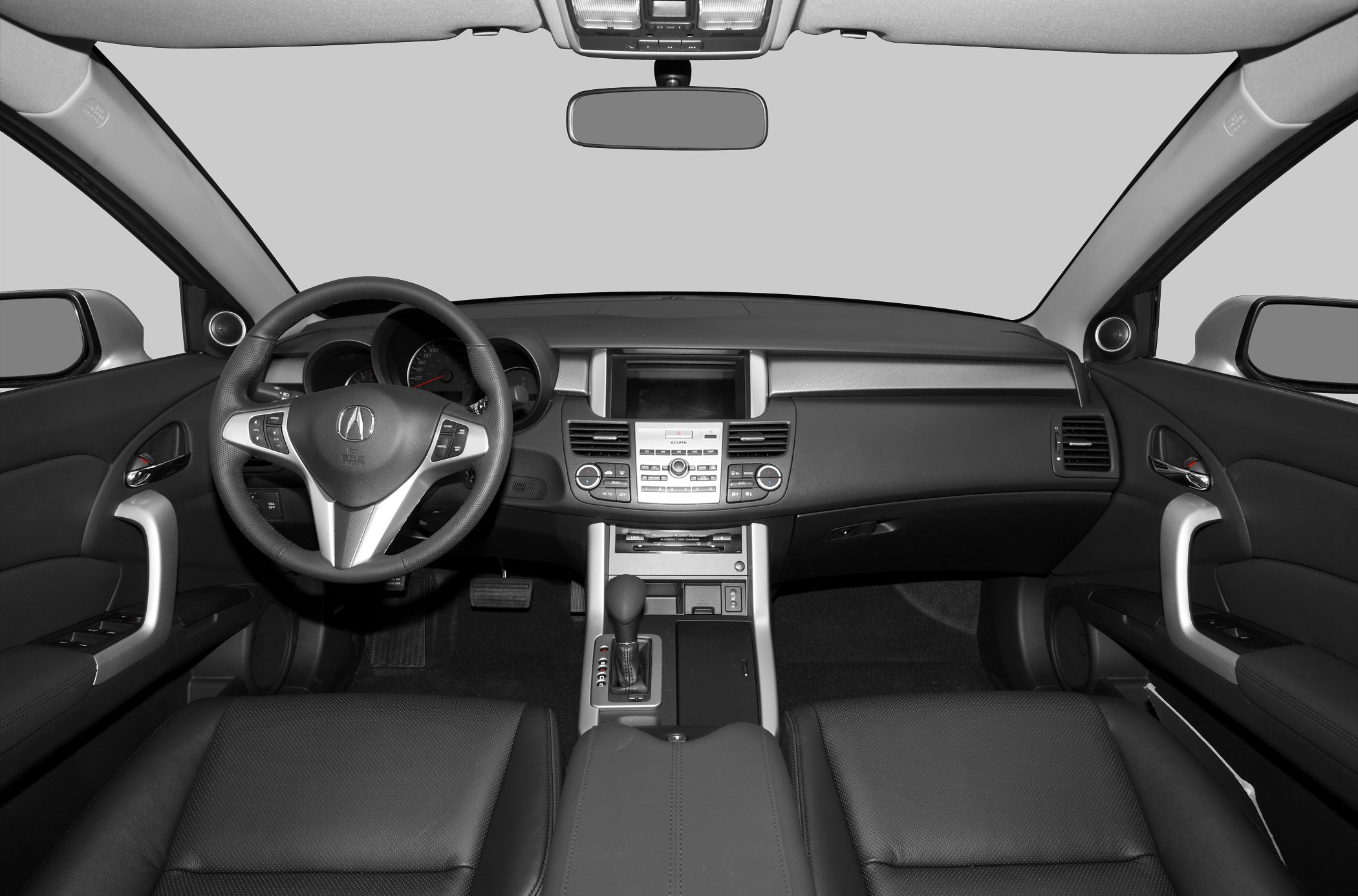 Interior view focusing on dashboard, steering wheel, and center console.