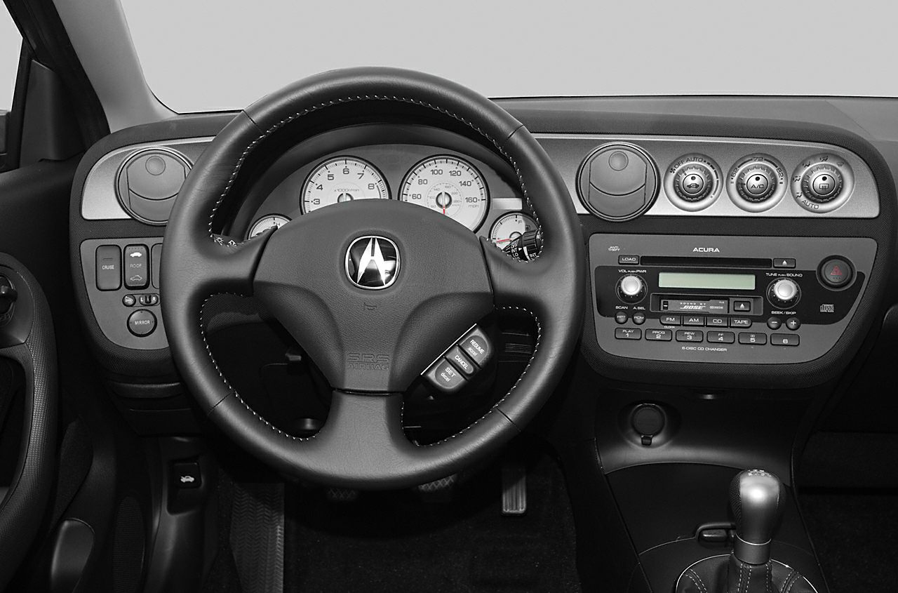 Steering wheel, instrument cluster, center console with controls and gear shifter