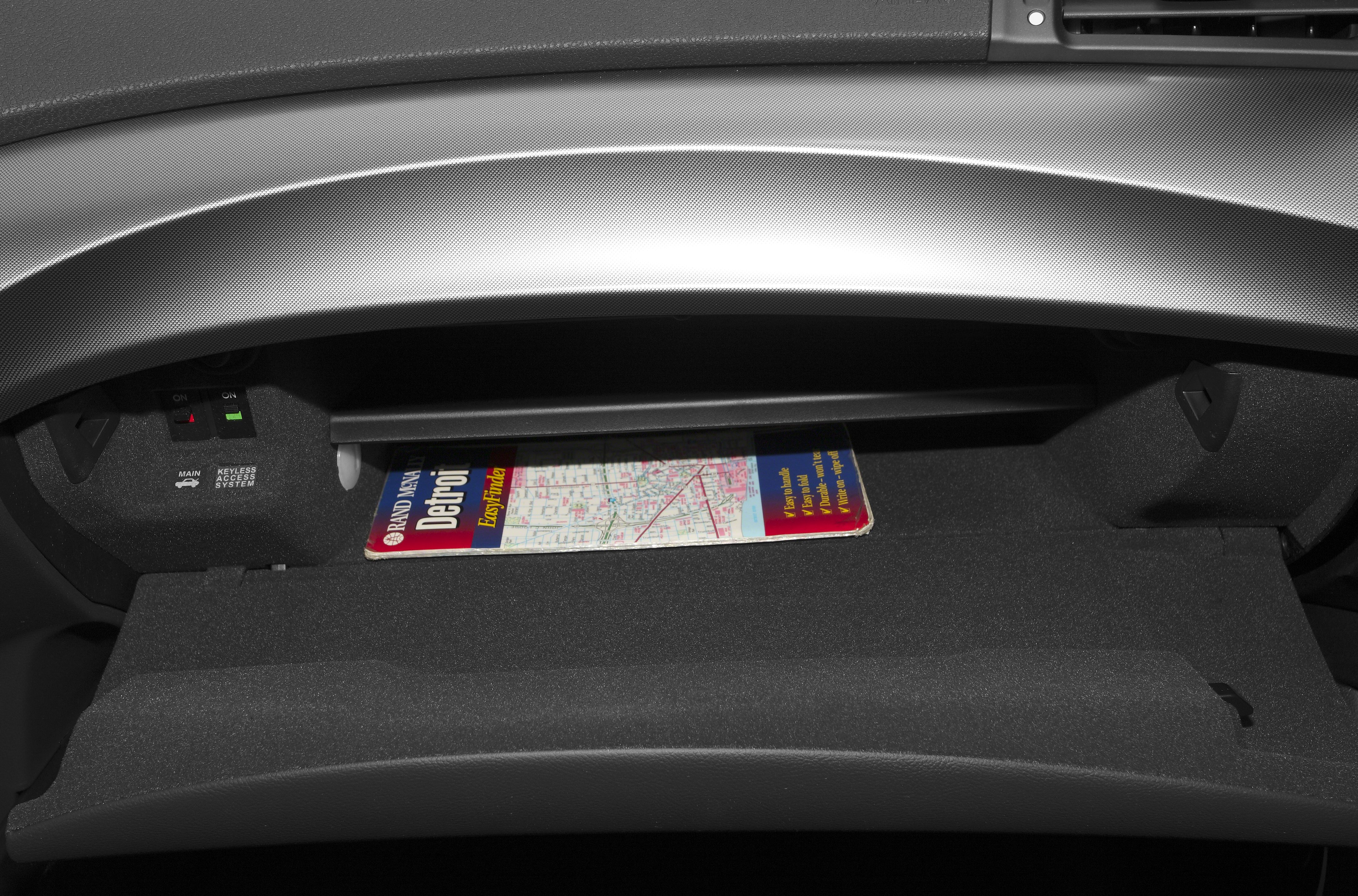 Glove compartment with keyless access controls and map storage