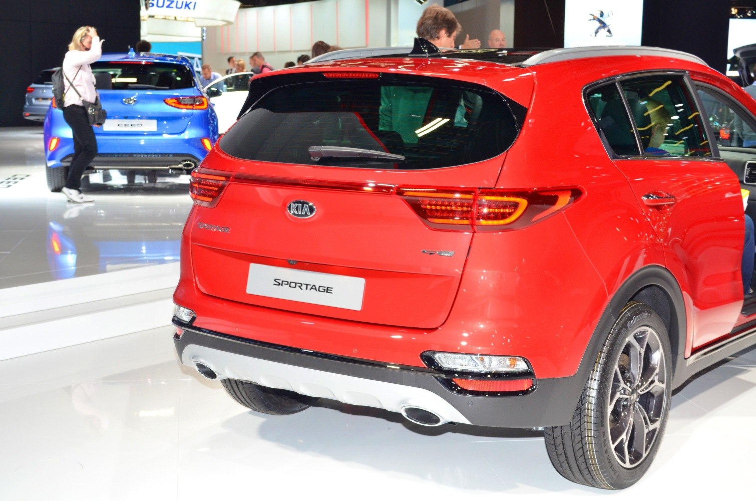 Rear view showing tail lights, dual exhaust tips, and alloy wheels.