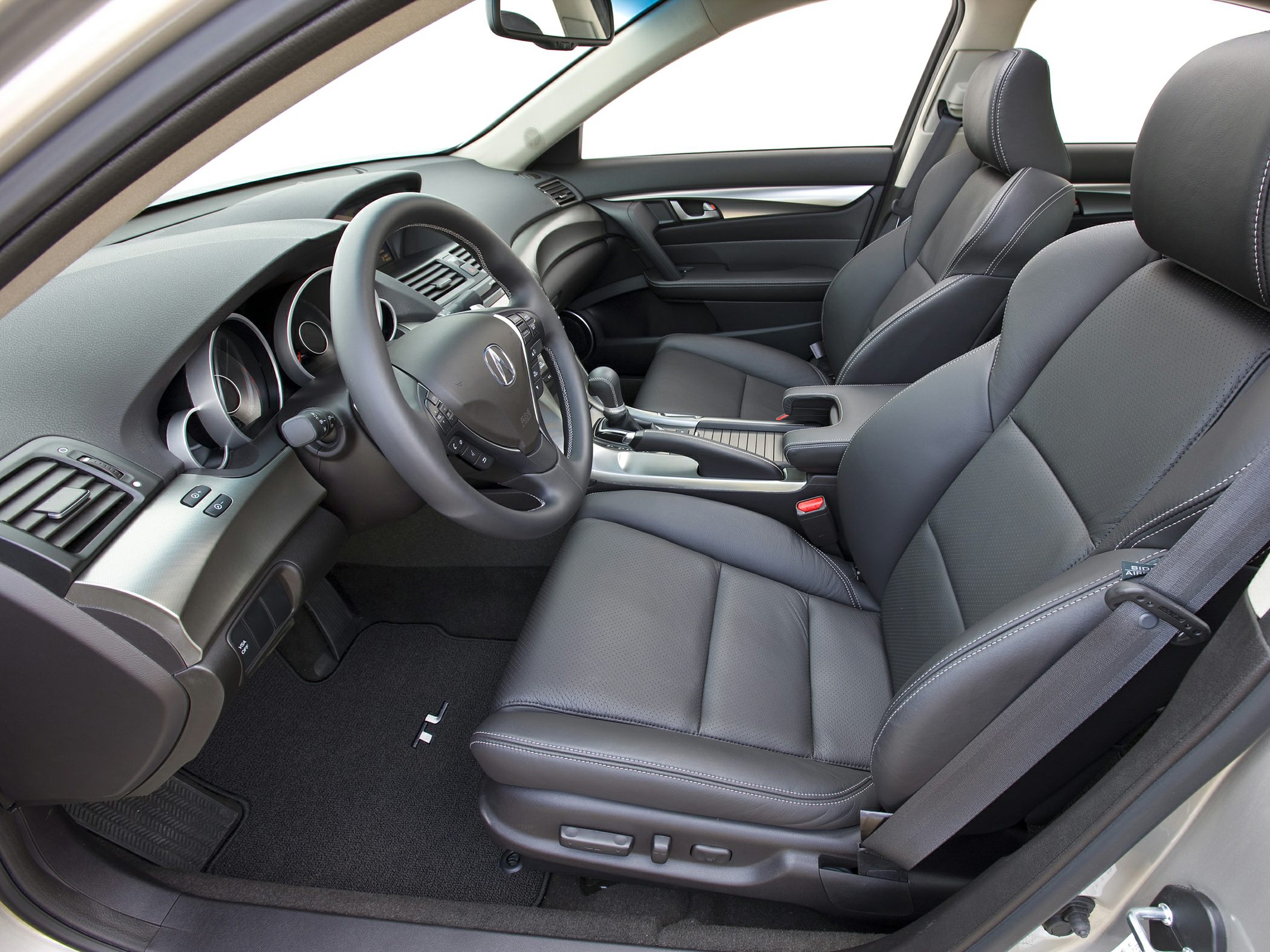 Leather front seats with detailed dashboard and steering wheel controls