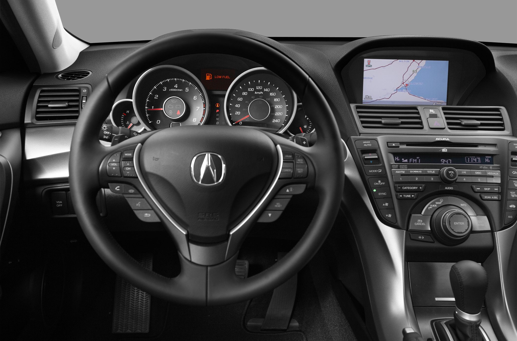 Dashboard with digital navigation screen and multifunction steering wheel controls