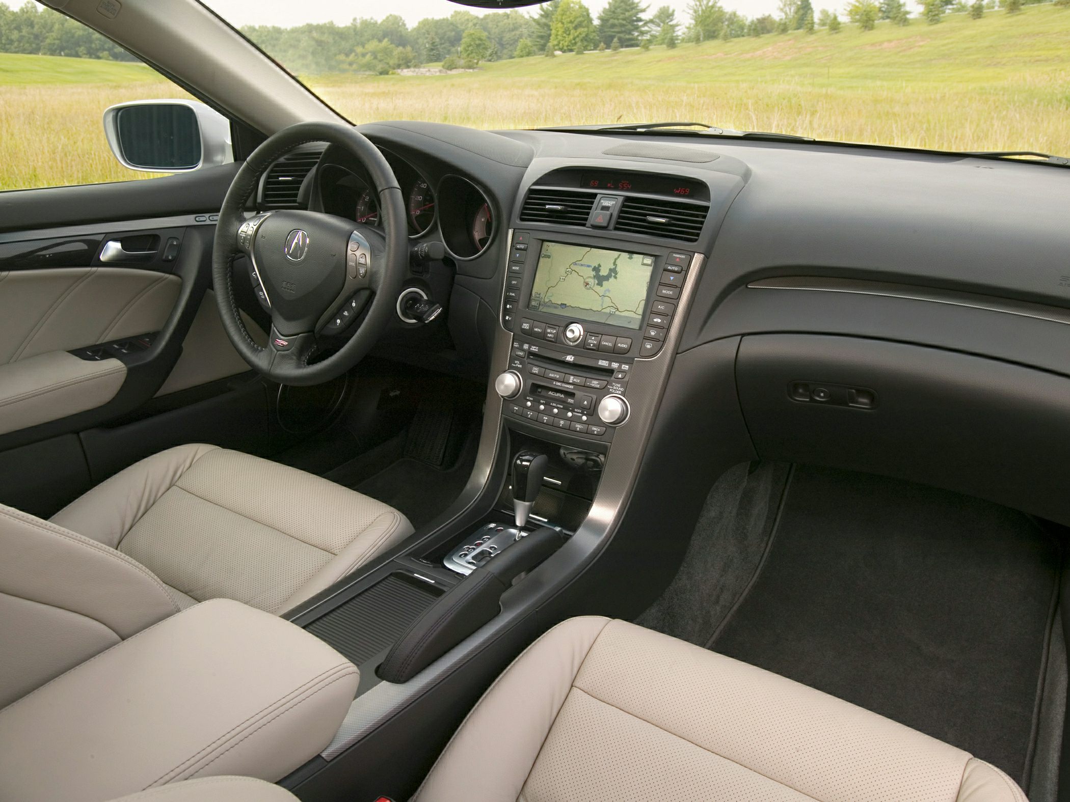 Leather seats, navigation system, ergonomic dashboard, steering controls