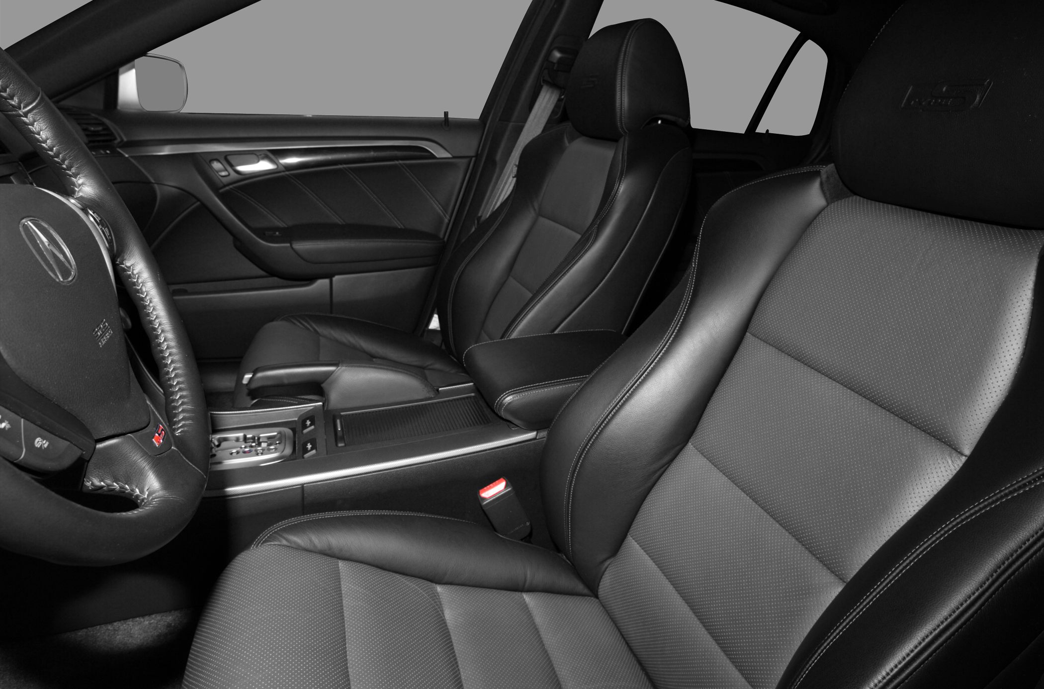 Leather seats and steering wheel with detailed stitching